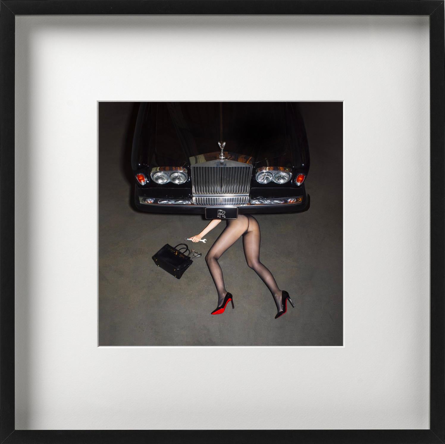 Roadside Assistance, woman with heels under a car, Fine Art Photography, 2022 - Black Color Photograph by Tyler Shields