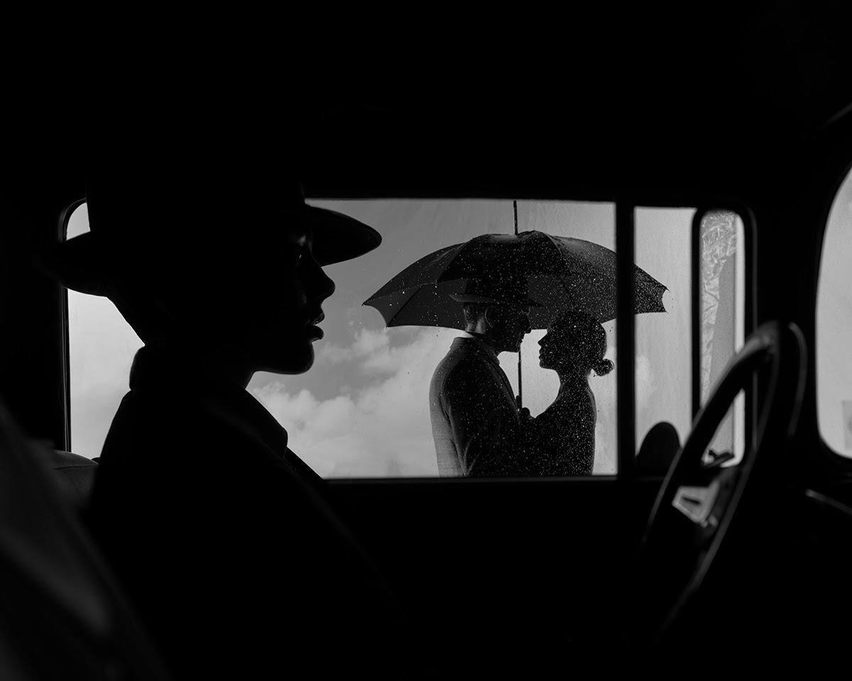 Tyler Shields Black and White Photograph - The Couple Out The Window (63" x 84")