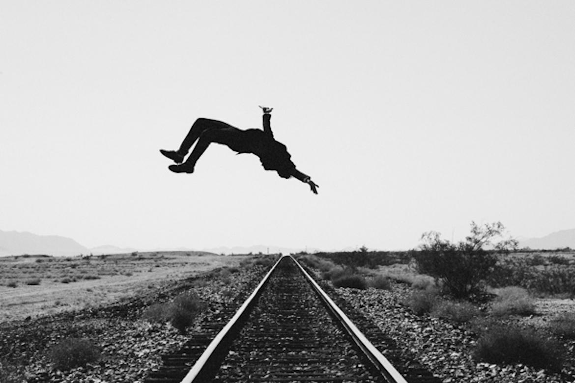 Tyler Shields Black and White Photograph - Train Tracks (20" x 30")