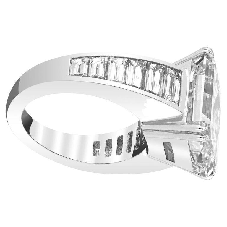 Emerald-cut diamond of 5.47  carats 

GIA, certified 5.47 carats carats, D color, Flawless clarity
TYPE 2A

the ring is composed by baguette emerald cut diamonds 

