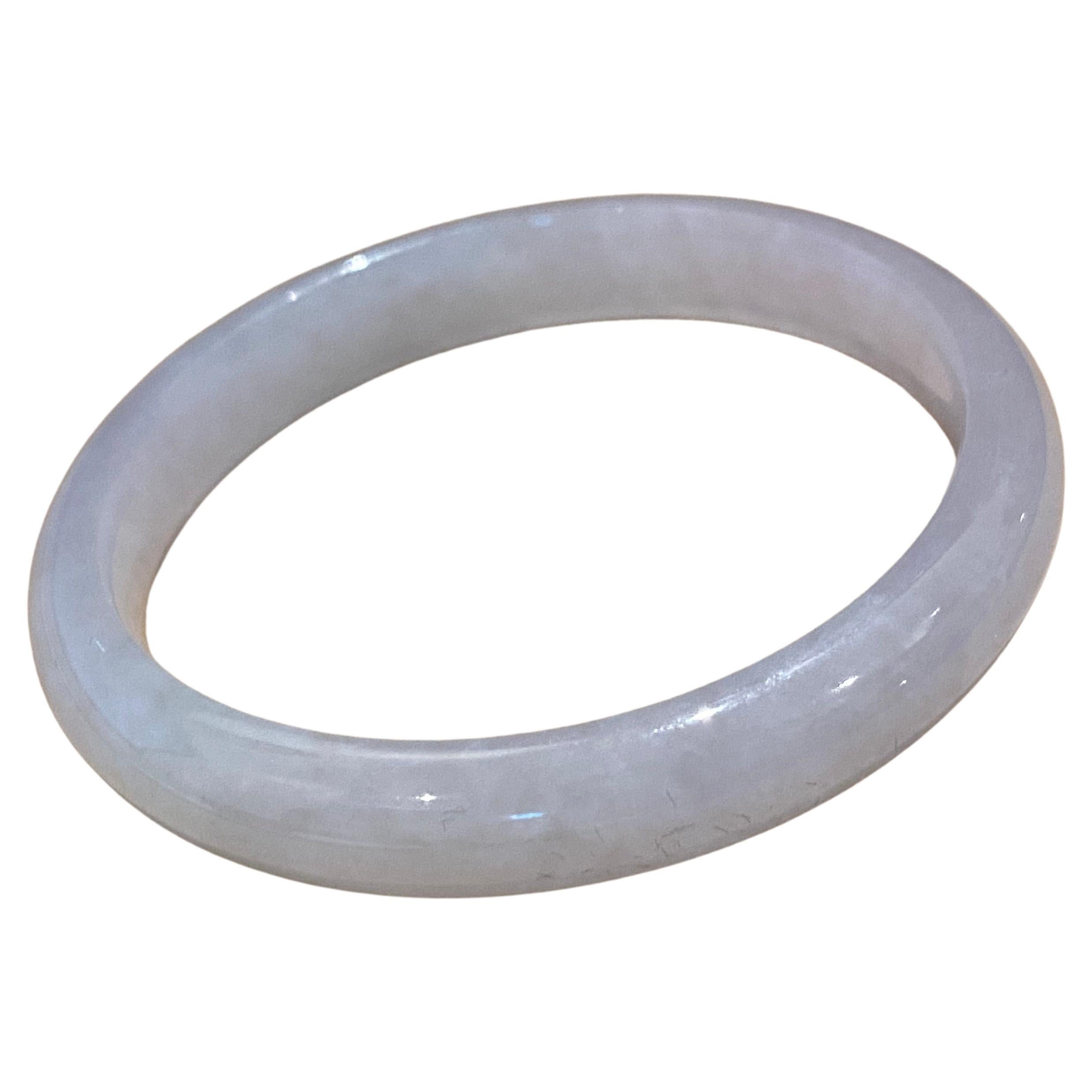 Type A Jadeite Bangle, of even Greyish White colour. 24.6gr. 9mm wide + GSL cert For Sale