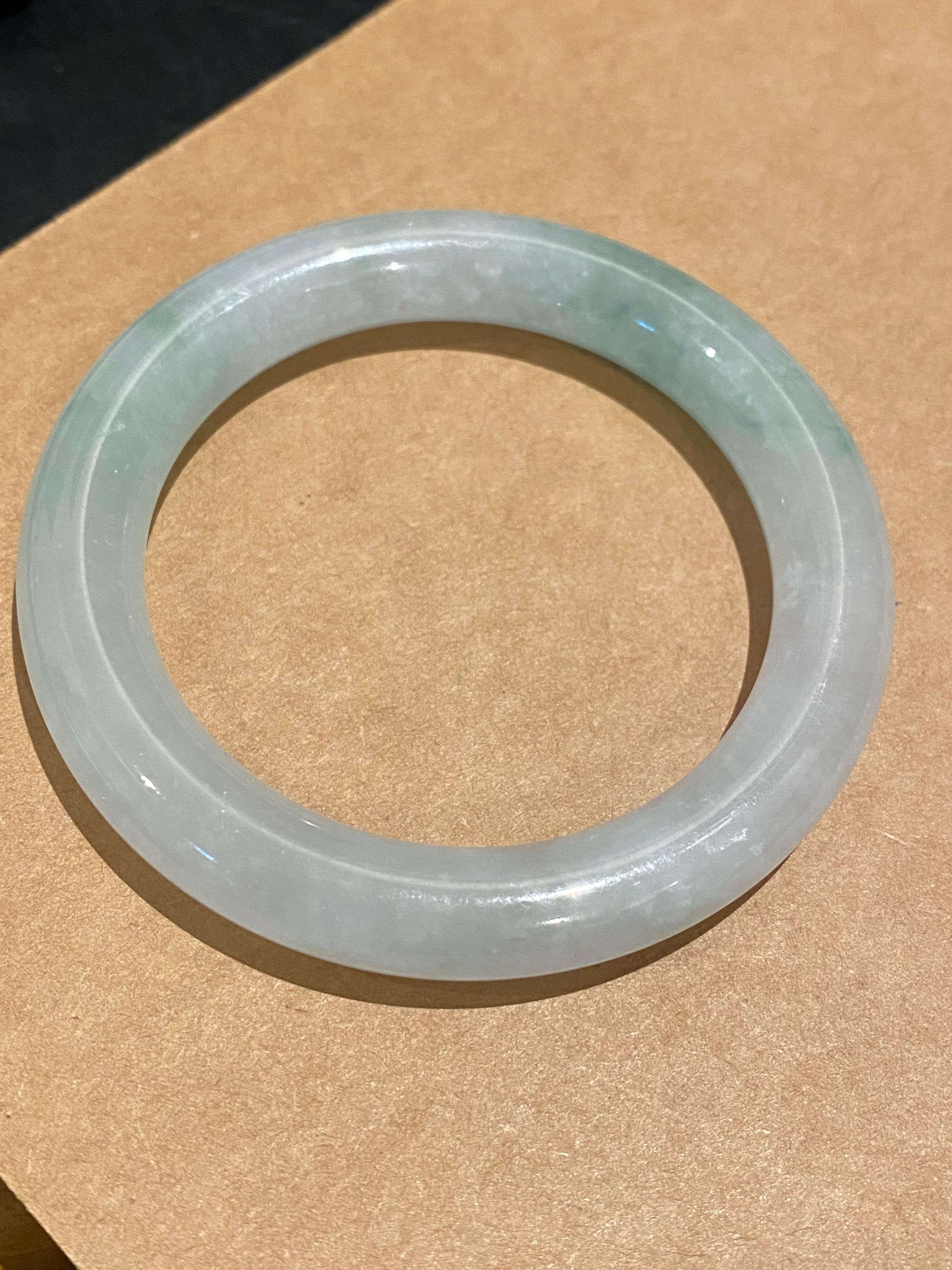Cabochon Type A Jadeite Bangle, of Greyish Green colour, 59.7gr. 21cm, 55mm in diameter. For Sale