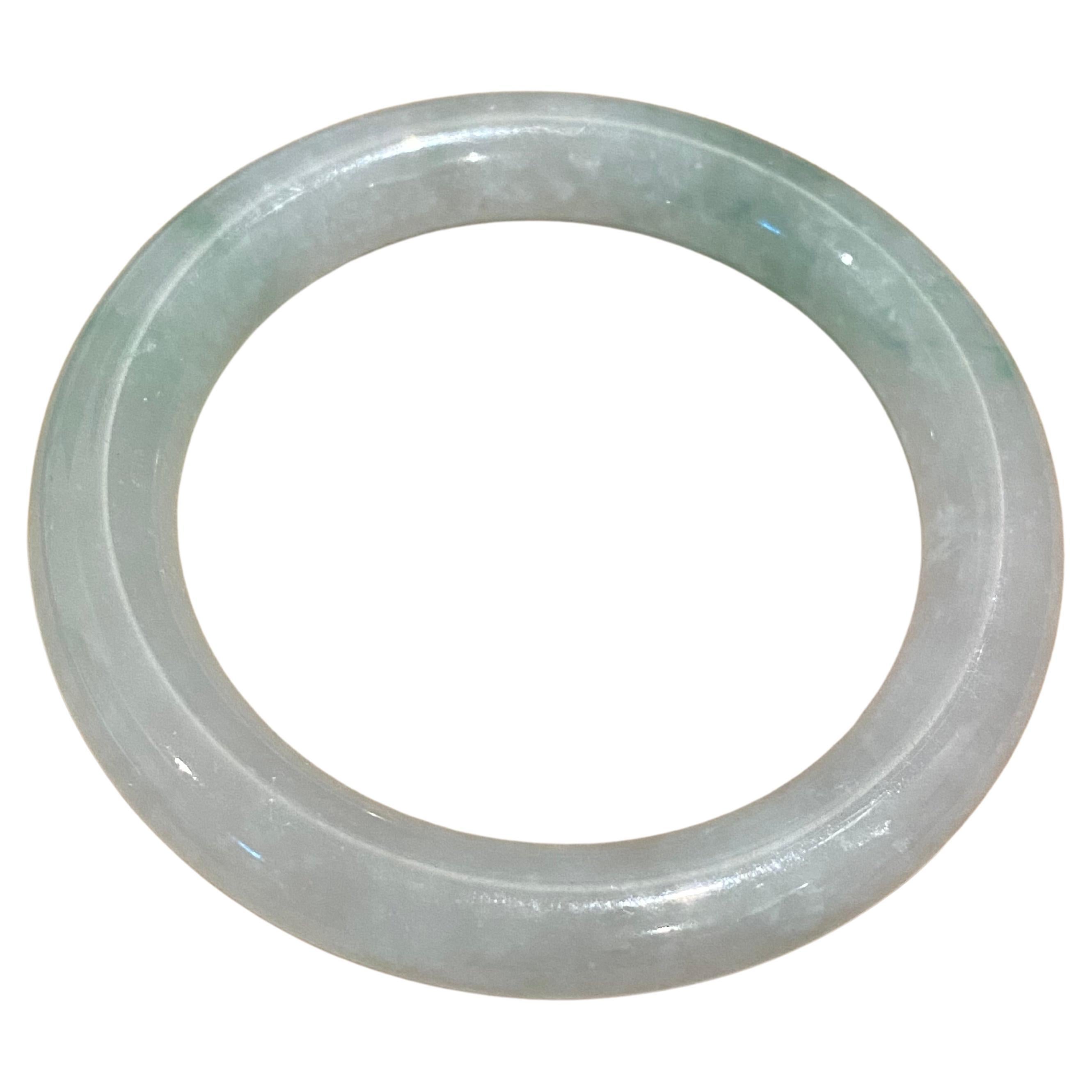 Type A Jadeite Bangle, of Greyish Green colour, 59.7gr. 21cm, 55mm in diameter. For Sale