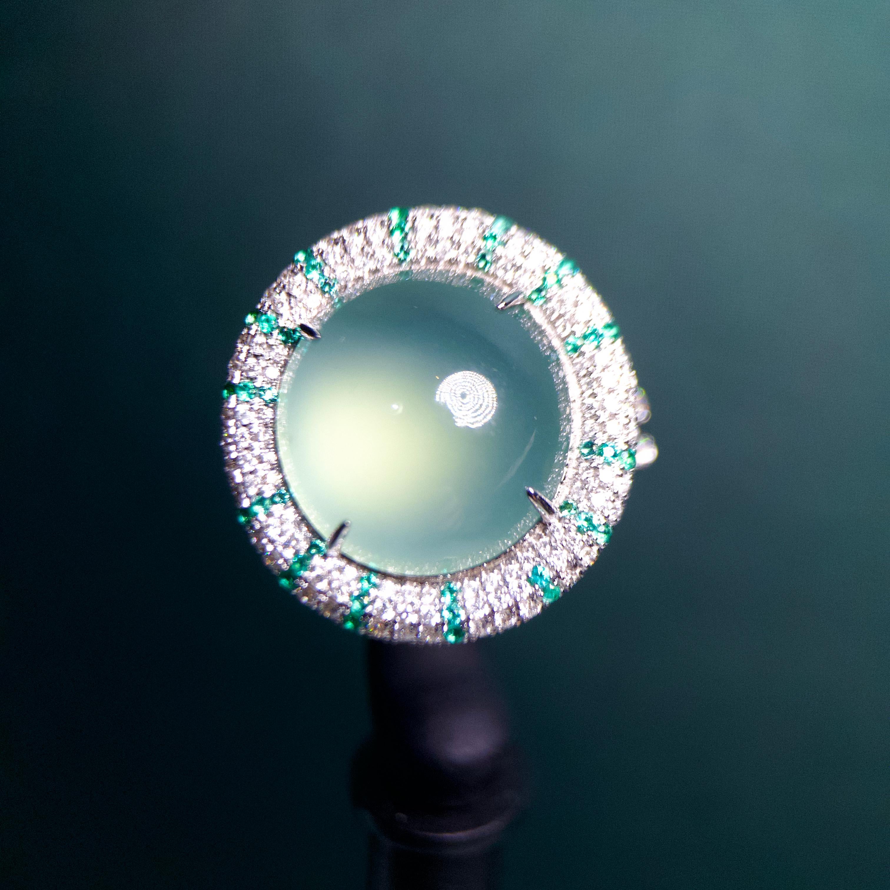 A Type A Natural Light Green Jadeite Jade, Emerald and Diamond Ring 18k White Gold 
Total Emerald weight is 0.203 ct
Total Natural diamond weight is 0.836 ct

US Ring Size is 8 , The Inner Diameter of the Ring is 18.14 mm
