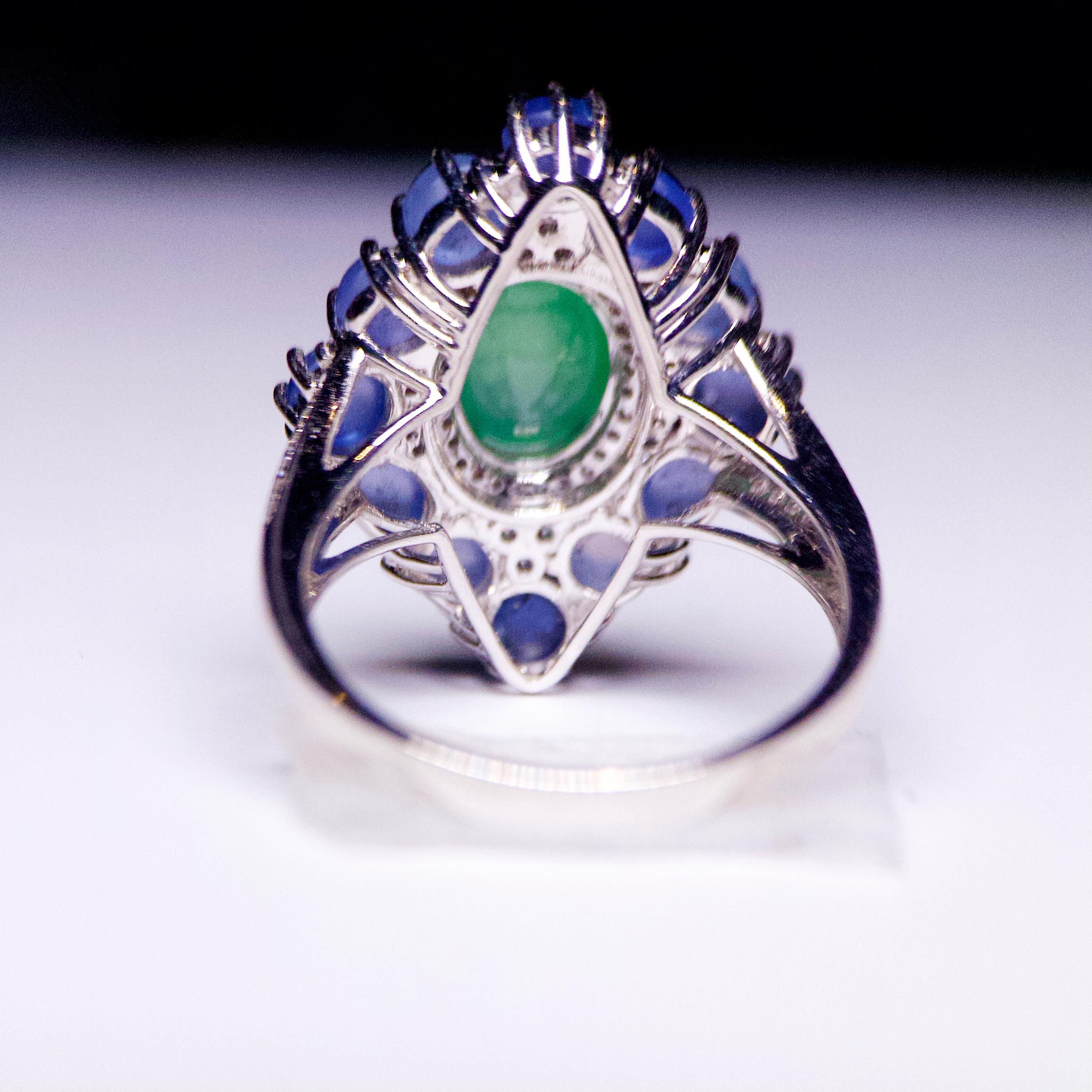 This is a kite-shape ring with Green Jadeite and Blue Star Sapphire. The apple green Jadeite is situated in the middle of the ring with diamond pave surrounded it. On the oter layer, there are 12 Blue Star Sapphire cabochon in different shades. It