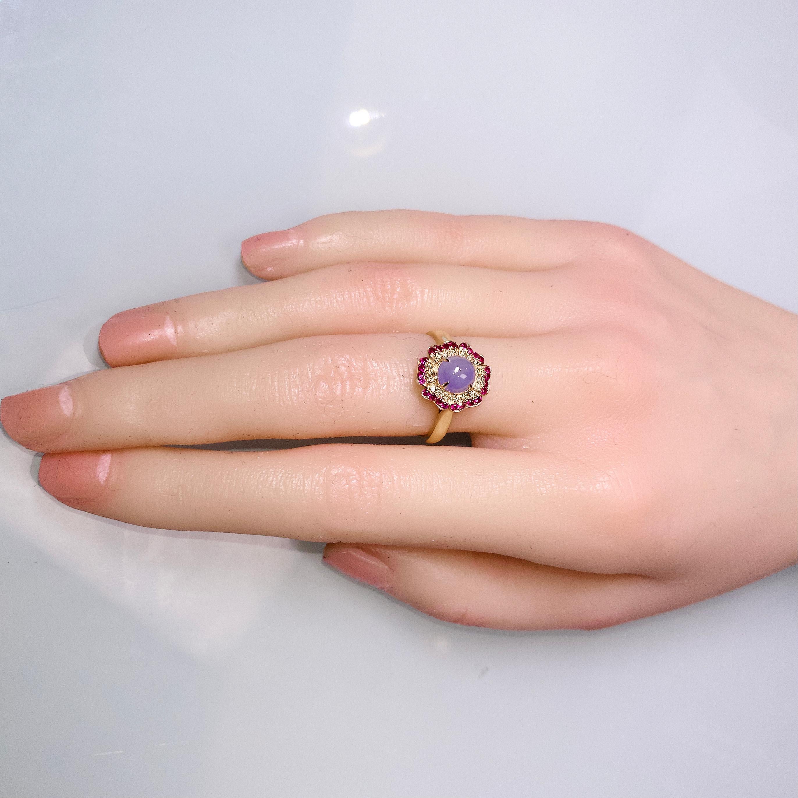 The Type A Lavender Jadeite Cabochon is sitting in the middle of a flower motif, with petals encrusted in Rubies and Diamonds. This is a very small and cute ring suitable for everyday wear.

Total ruby weight is 0.21 ct
Total Natural Diamond weight