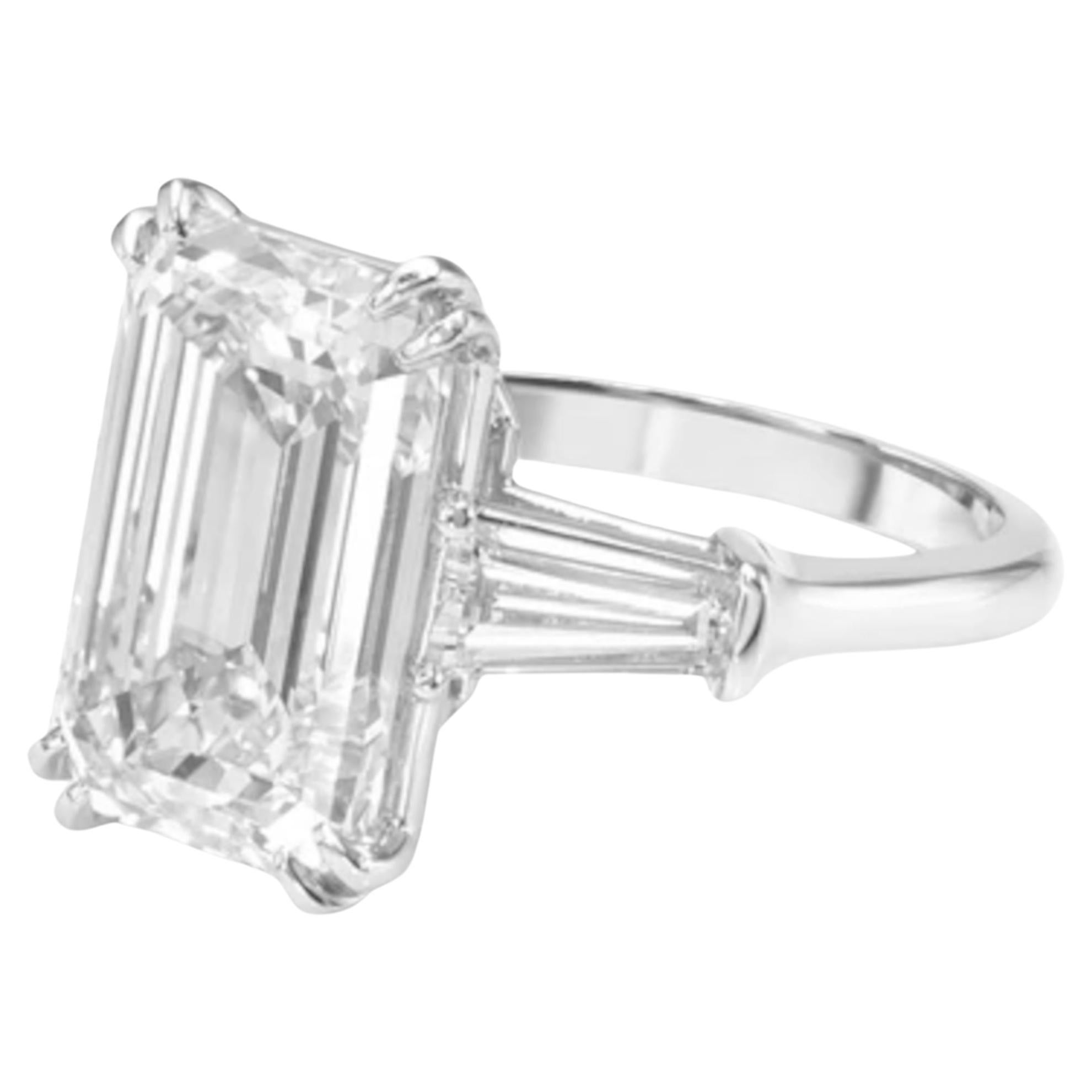 Presenting a breathtaking GIA Certified 10.05 carat emerald-cut diamond set in elegant 18K white gold, accented by classic tapered baguette diamonds on each side. 

This extraordinary centerpiece boasts an I color grade, offering a near-colorless
