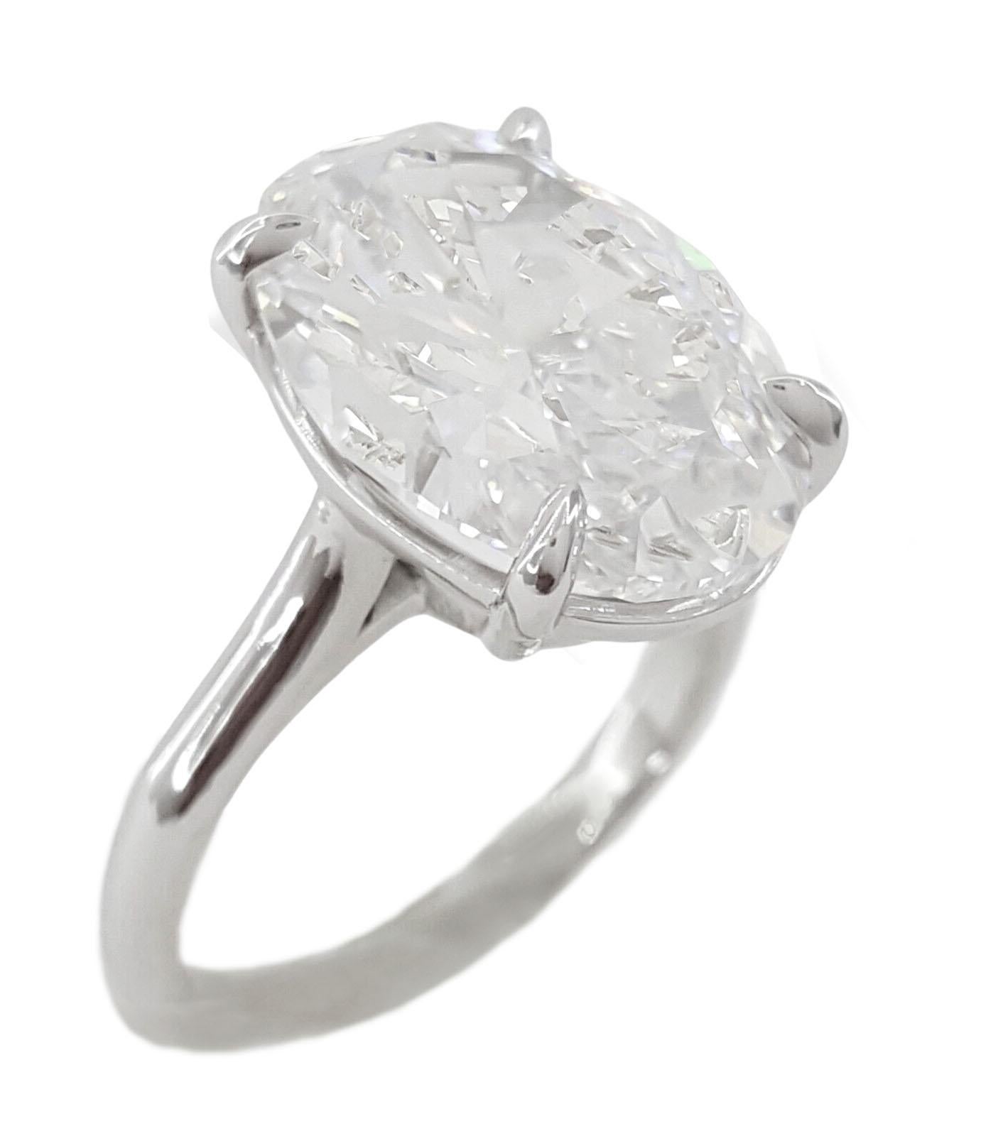Modern TYPE IIA GIA Certified 6 Carat Oval Brilliant Cut Diamond Platinum Ring For Sale