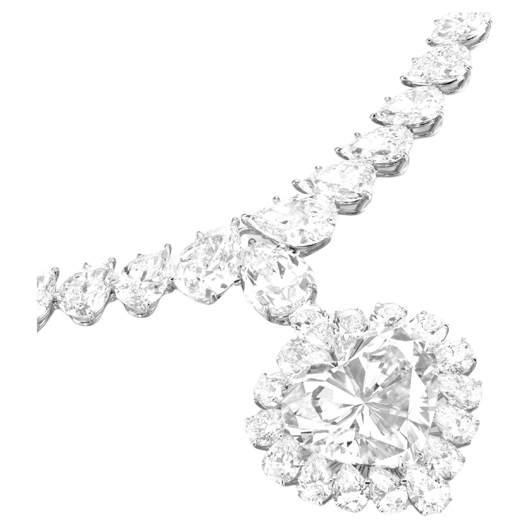 An exquisite 8 carat heart shape diamond pendant necklace set with an exceptional center stone! D color Flawless in clarity
the necklace is accompained by gorgeous pear cut diamonds
