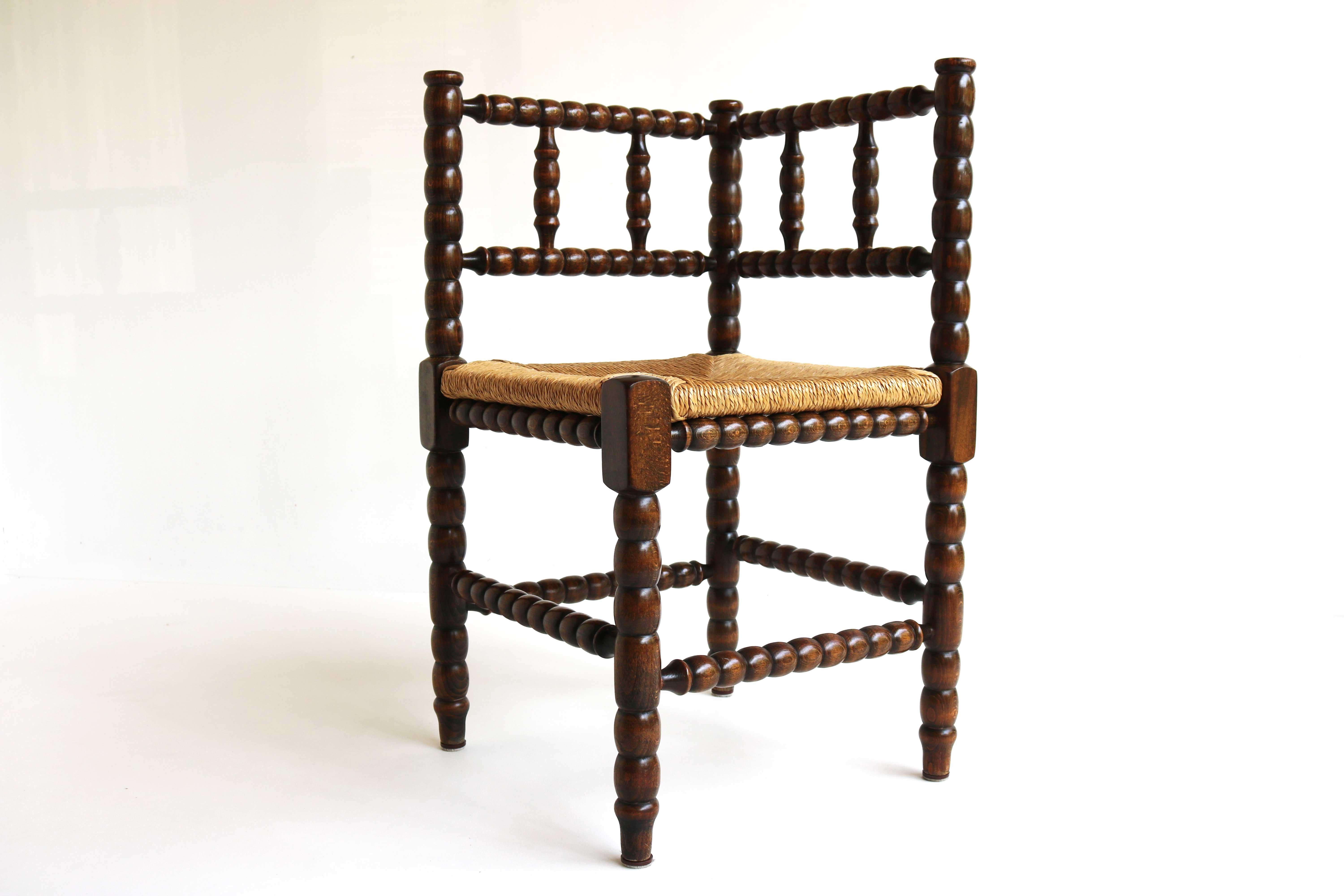 Lovely typical Dutch knitting chair.
This antique 'corner chair' with wicker seat is originally a typical Old Dutch knitting chair/ thelephone chair.
Older women used to often sit in these chairs knitting. These types of chairs were made with only