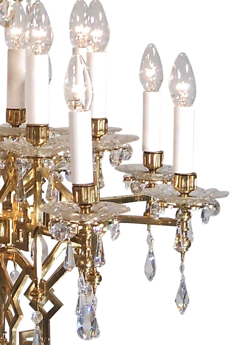 Beautiful early Viennese Art Deco chandelier, circa 1922, with typical ornaments for this period, partly casted parts, hand-cut crystal glass hangings. Restored, 16 flames.
Materials & techniques notes: brass polished and varnished,