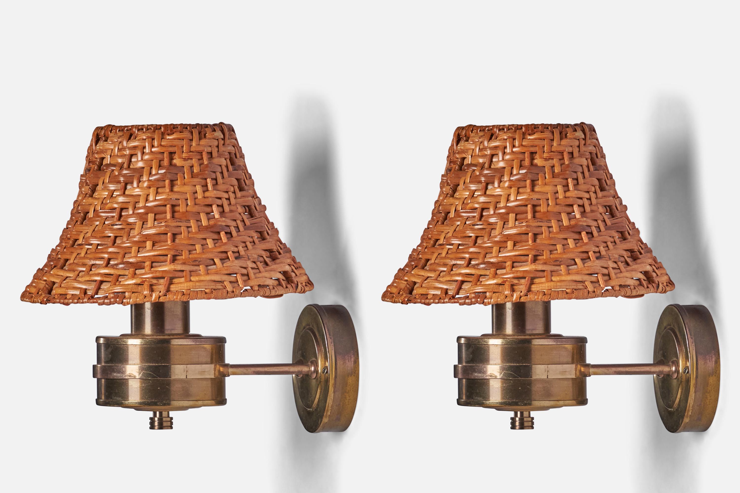 A pair of brass and rattan wall lights designed and produced by Tyringe Konsthantverk, Sweden, 1970s

Overall Dimensions (inches): 9.5” H x 8.75” W x 10.25” D
Back Plate Dimensions (inches): 3.75” Diameter x 0.9” D
Bulb Specifications: E-26