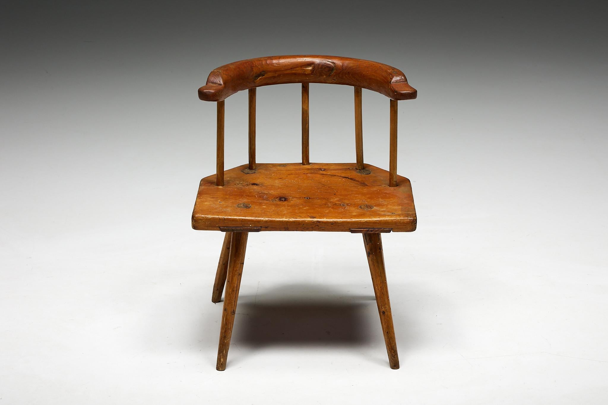 Tyrol; Tyrolean Chair; Famer's Chair; 19th Century; Stool; Escabelle; Solid Wood; 1800s; Austria; Low Armchair;

Tyrolean folk art low armchair, a stunning embodiment of late 19th-century craftsmanship that exudes timeless charm and rustic