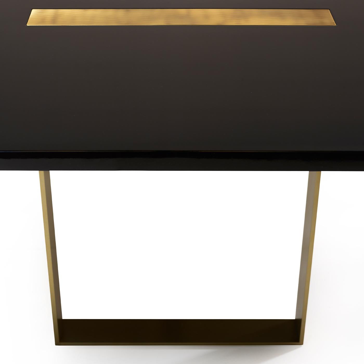 This elegant table, designed by Studio 63 for Marioni, has a lacquered rectangular wooden top with one rectangular brass insert and one rectangular marble and metal insert. These two elements extend downwards serving also as supports for the table.