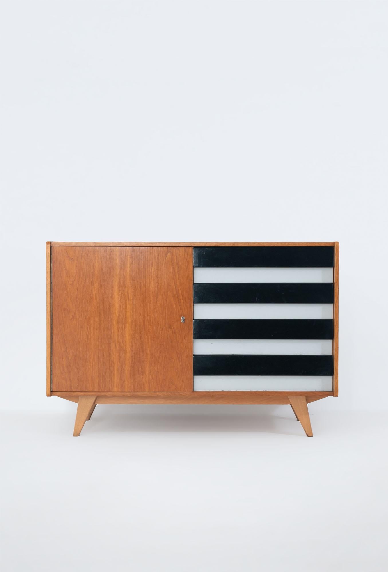 U-458 sideboard by Jiri Jiroutek for Interier Praha, former Czechoslovakia, 1960s. 
Oak veneered body with mahogany inside which makes a nice contrast. 
Plastic drawers with white formica and glossy black front. 
Wood refinished with new