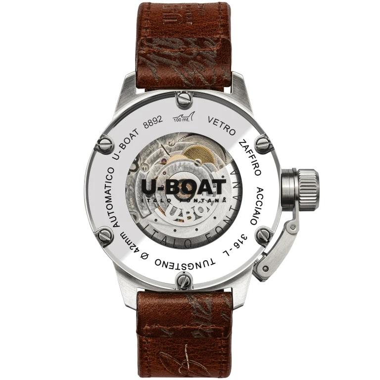Silver-tone stainless steel case with a brown leather strap. Fixed silver-tone stainless steel bezel. Beige dial with beige hands and Arabic numeral & index hour markers. Dial Type: Analog. Luminescent hands and markers. Date display at the 9