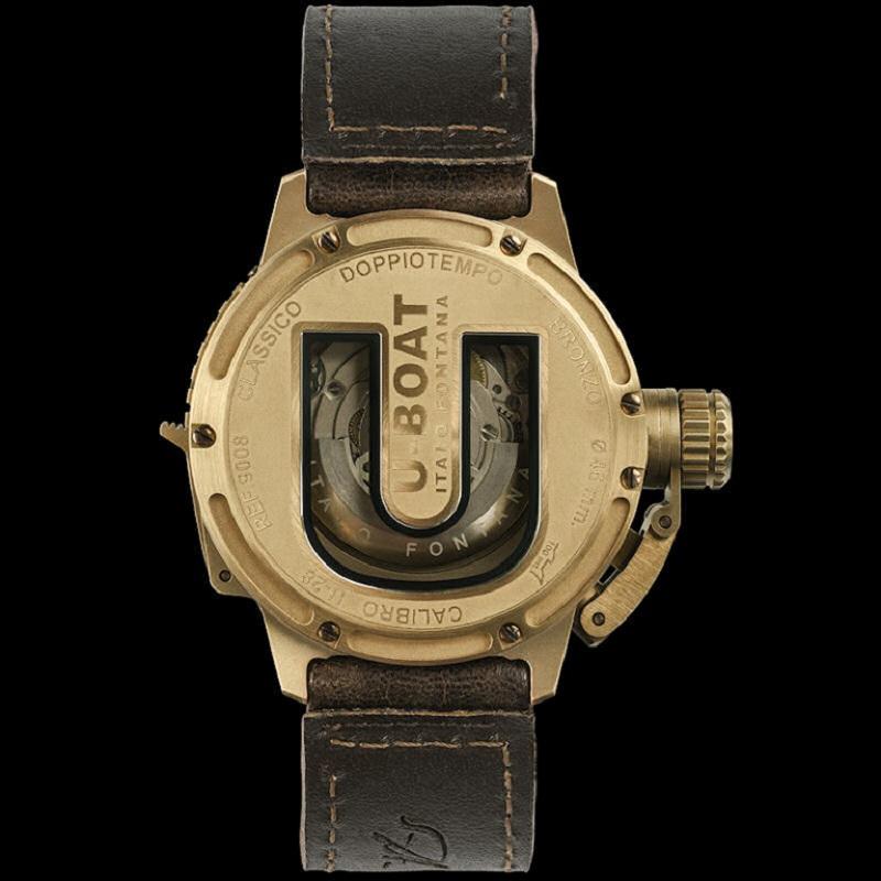 Naturally aged bronze case with a green leather strap. Bi-directional rotating bronze naturally aged bronze bezel. Green dial with beige hands and Arabic numeral and index hour markers. Dial Type: Analog. Luminescent hands and markers. Date display