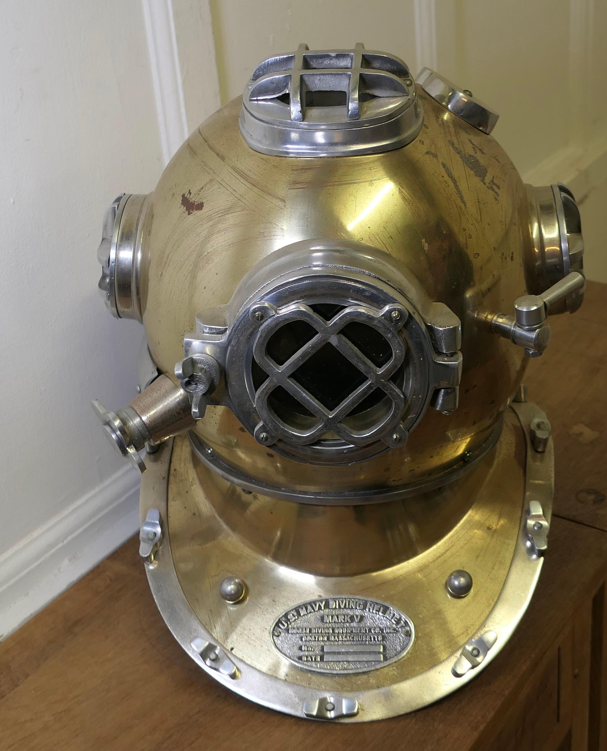 U S Navy Mark V Diving Helmet Military Prototype 

The Helmet is a replica model of US Navy equipment, the helmet is a full size piece made in chrome brass and set on a shoulder stand
In sound condition and a dramatic looking piece 
The Helmet is