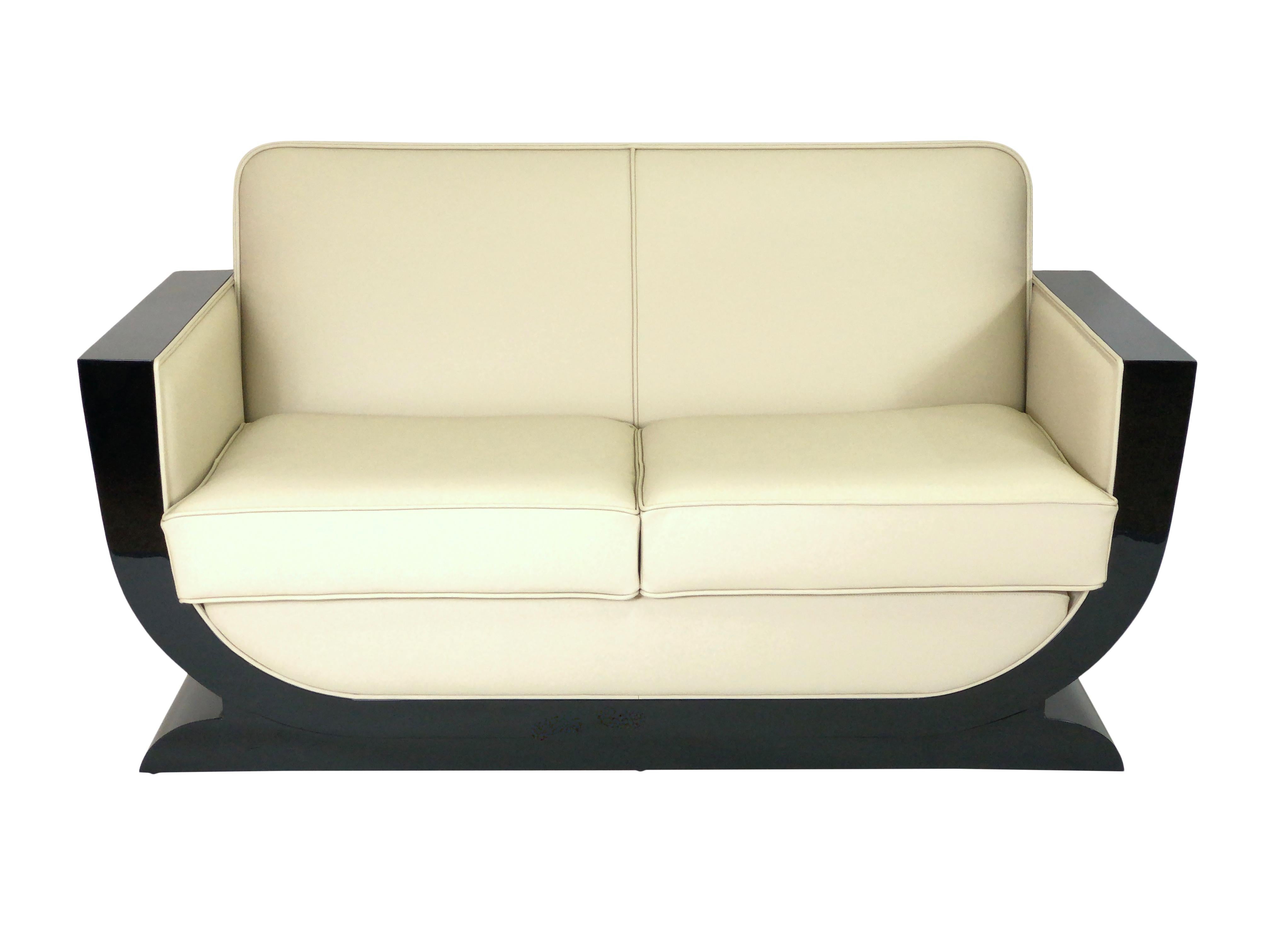Beige leather on black lacquered wood.

Typical French Art Deco shape.
Elegant and timeless design.

High quality!
Handmade in Germany.
Different upholstery, leather colors, woods, lacquer colors or surface finishes on request.

The