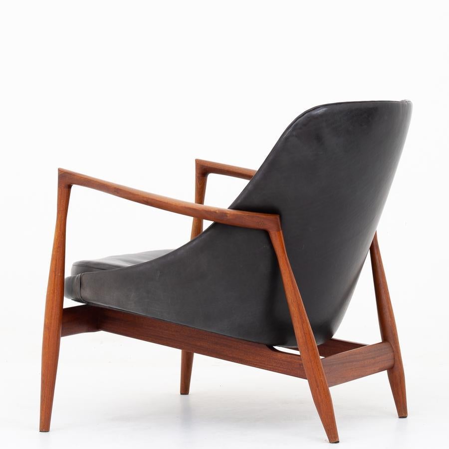 U56 - 'Elizabeth' lounge chair in mahogany with original, patinated leather. Designed in 1956. Rare model. Maker Christensen & Larsen.