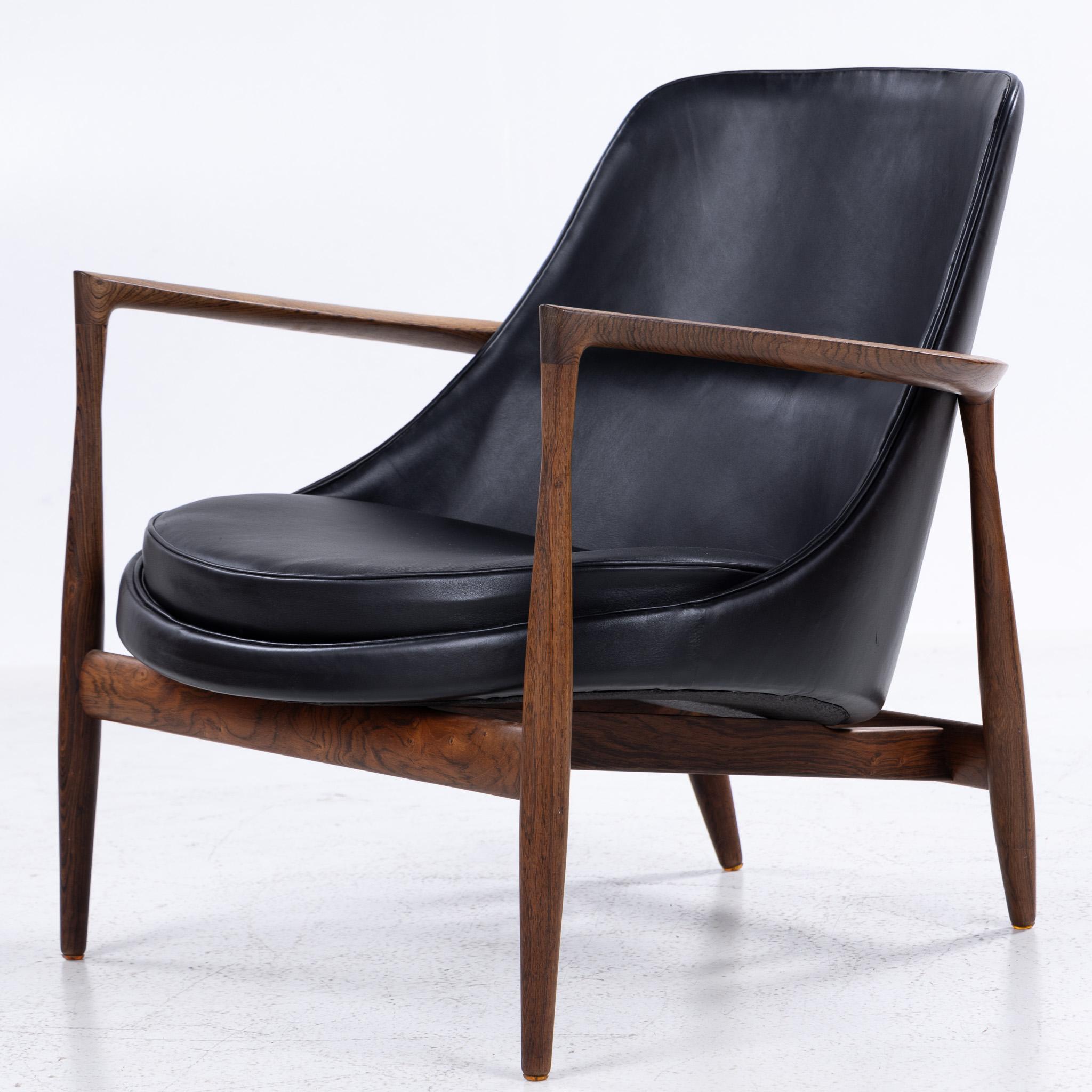 Model U56 - Reupholstered ‘Elizabeth’ easy chair in black ‘Elegance’ aniline leather with frame in Brazilian rosewood. Designed in 1956 by Ib Kofod-Larsen. Made by Christensen & Larsen.