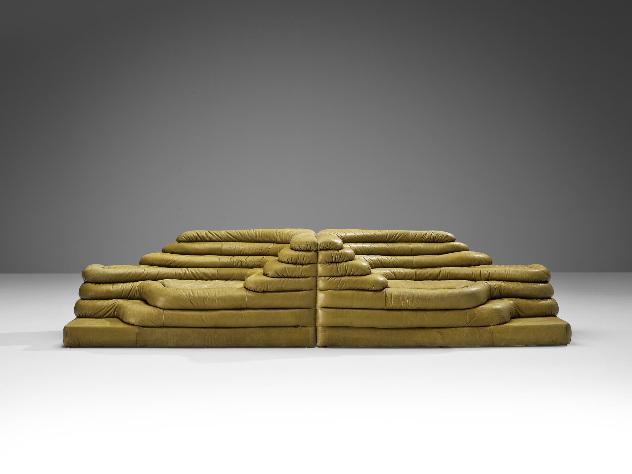 Ubald Klug for De Sede, pair of DS-1025 'Terrazza' landscape sofa elements, leather, Switzerland, 1970s. 

Waterfall shaped sofas in olive green leather by the Swiss manufacturer De Sede. The design for this sofa was inspired by mountains and