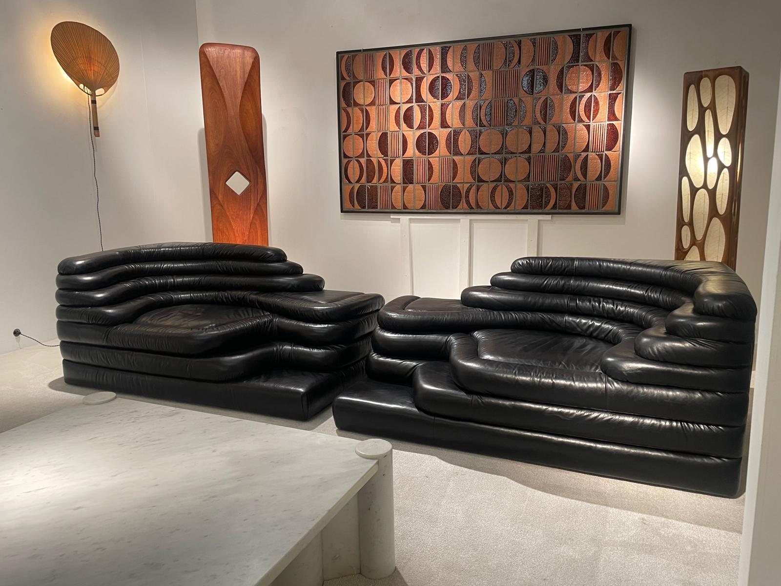 Pair of DS-125 Terrazza sofas in dark brown leather, designed by Ubald Klug for De Sede in the seventies. The Nature-inspired shapes of this sofa combined with the high quality of construction make it a true work of seating art!