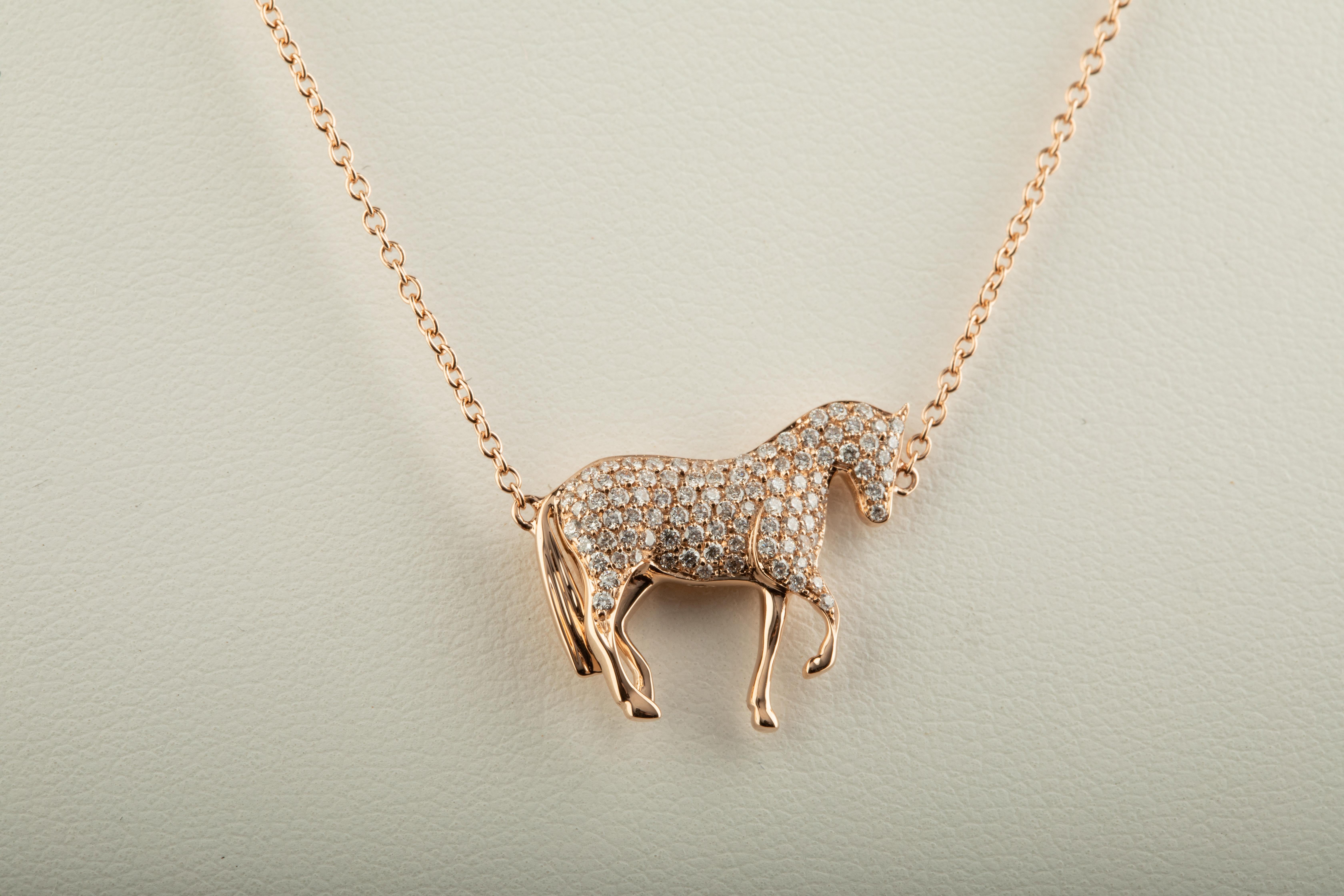 Ubaldi Gioielli, Equestrian jewelry, hand made in Italy, 
exclusive design and manufacture,
this horse pendant, with a very fine design and an amazing Diamonds pave setting, has a rolo 18kt rose gold chain and adjustment HorseBites links for an easy