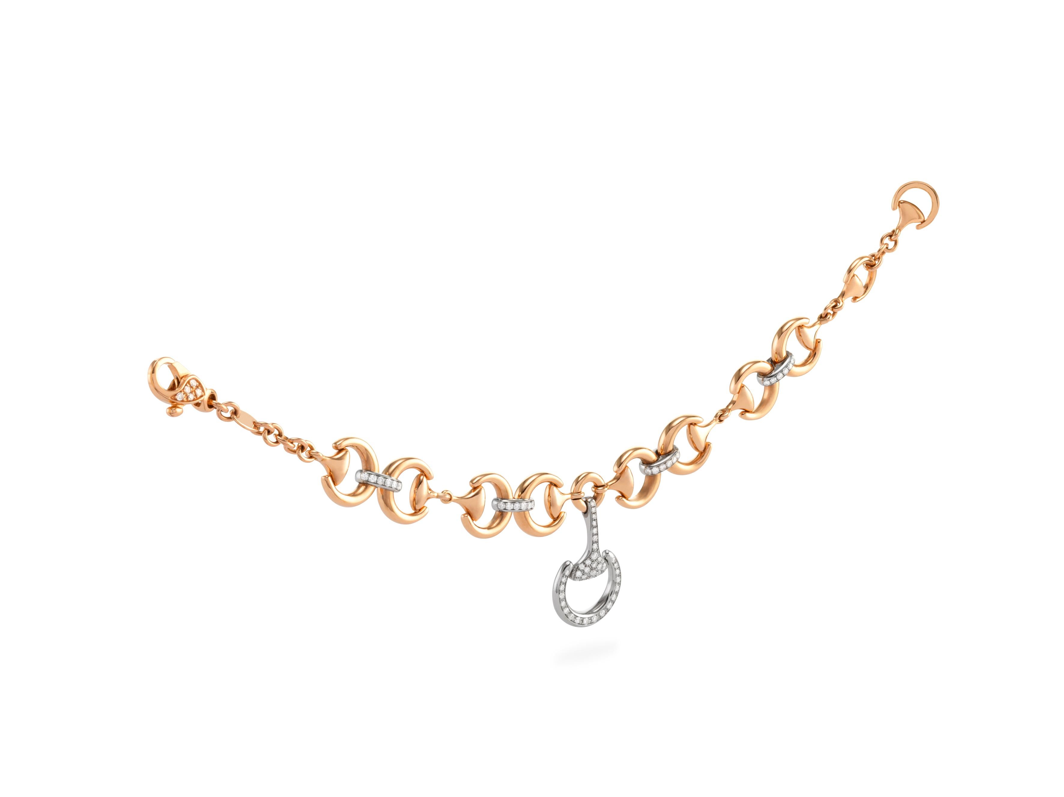 here we propose an Handmade in Italy,  Ubaldi Gioielli,  Horse bit  bracelet in white and rose gold 18k 
Horse-bit detail chain in rose gold 18k
Diamonds pave, and onto the latch an additional pavè of diamonds is present G color and VVs clarity, for