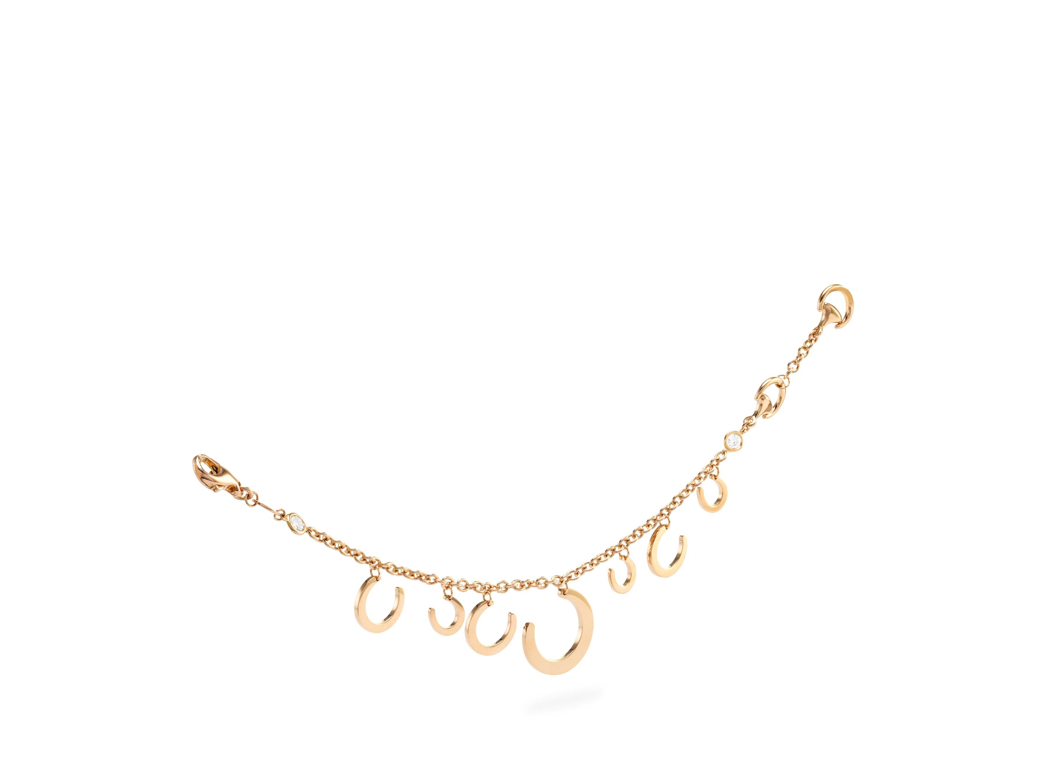 here we propose an Handmade in Italy,  Ubaldi Gioielli,  Handcrafted “Horseshoe” bracelet made in rose gold 18k 
Rolo chain in rose gold 18k 

Two diamonds on the rolo chain, G color and VVS clarity, for a total Carat weight of 0.22 Ct.

The