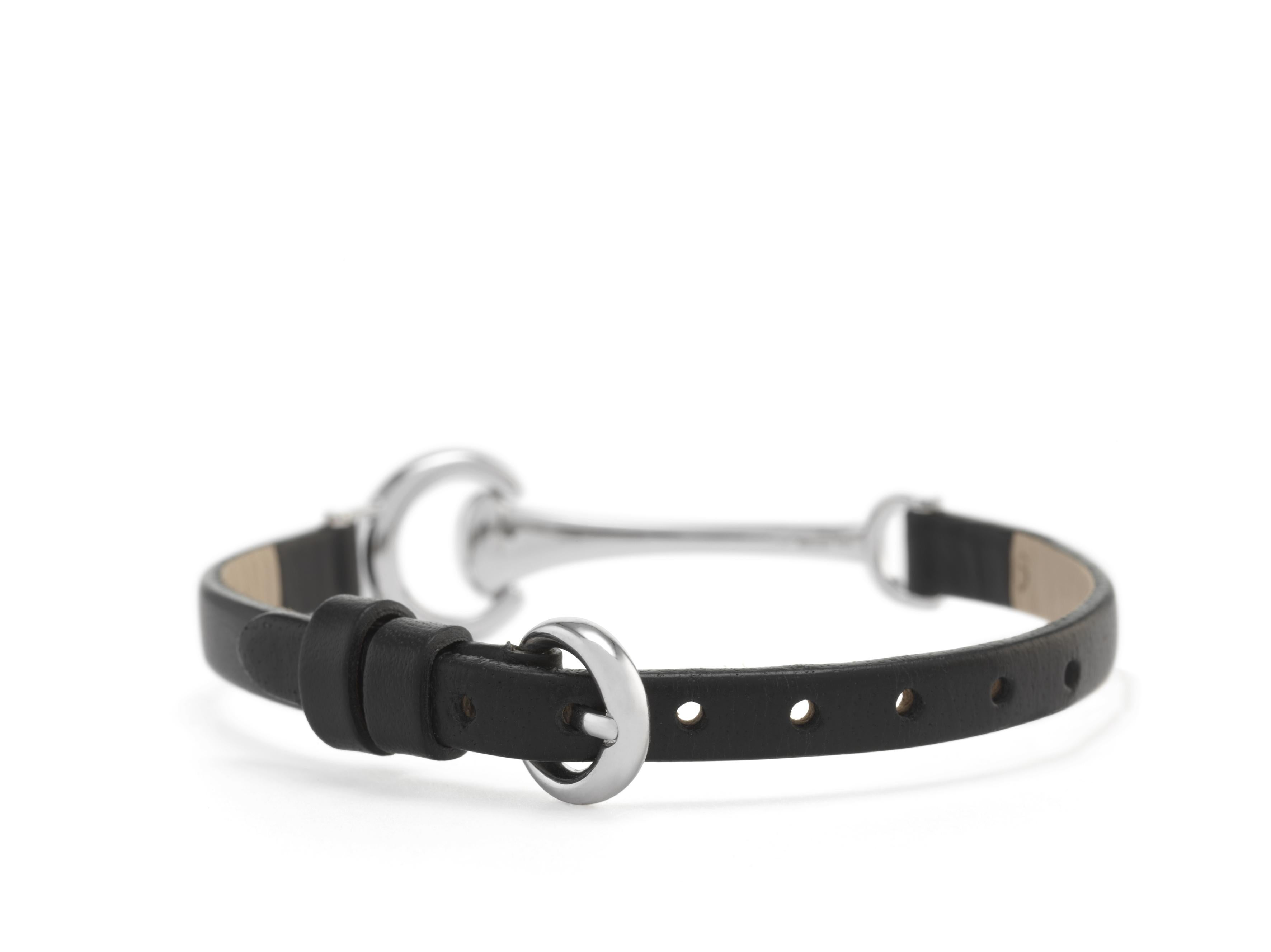 Handcrafted “Horse bit” bracelet in white gold 18k, with custom black calfskin leather strap.
18kt White gold buckle.

The HorseBit, symbol of elegance and belonging to the equestrian world.
The horseshoe and the horsebit, equestrian symbols, brings
