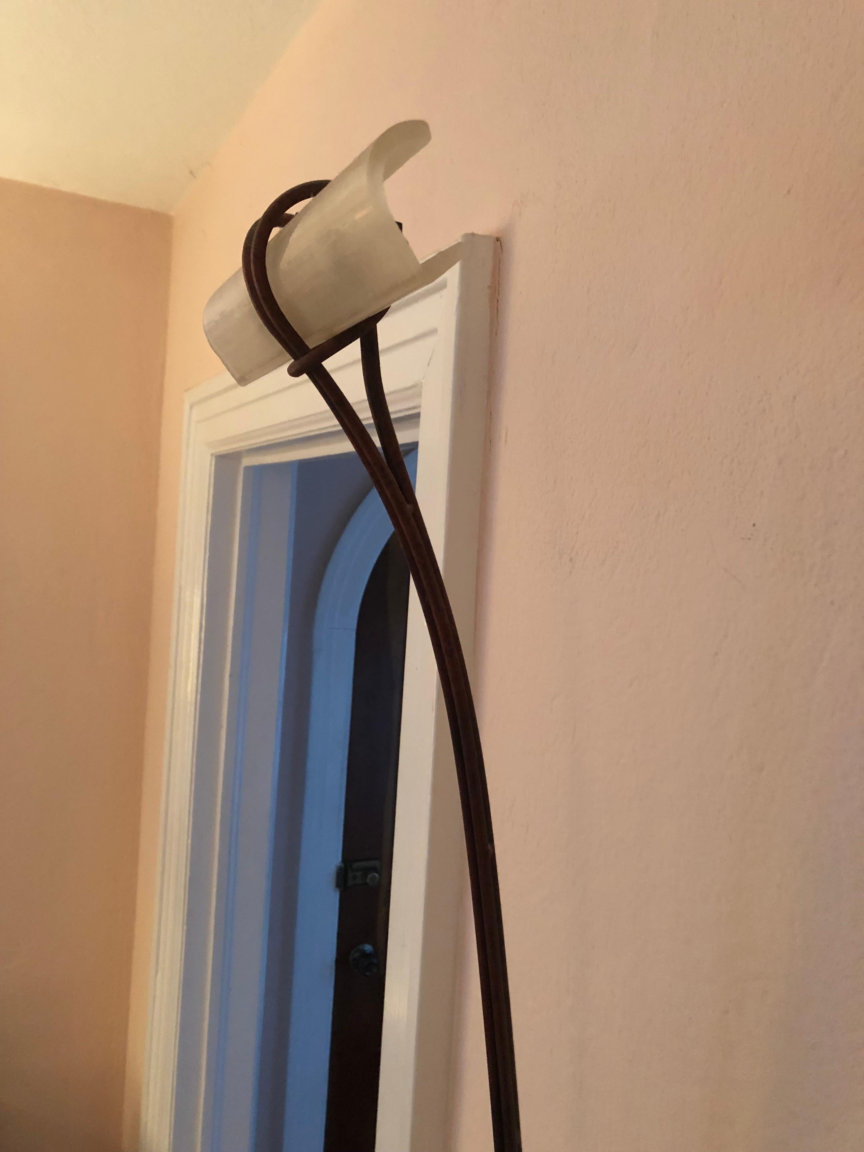 Super chic Italian bronze patina elongated wall sconce having sinuous Silhouette and frosted glass horizontal shade at the top, circa 1990
The top is 9 w
The bronze plate at the bottom is 3.25 w x 2 h
Takes a Halogen bulb.