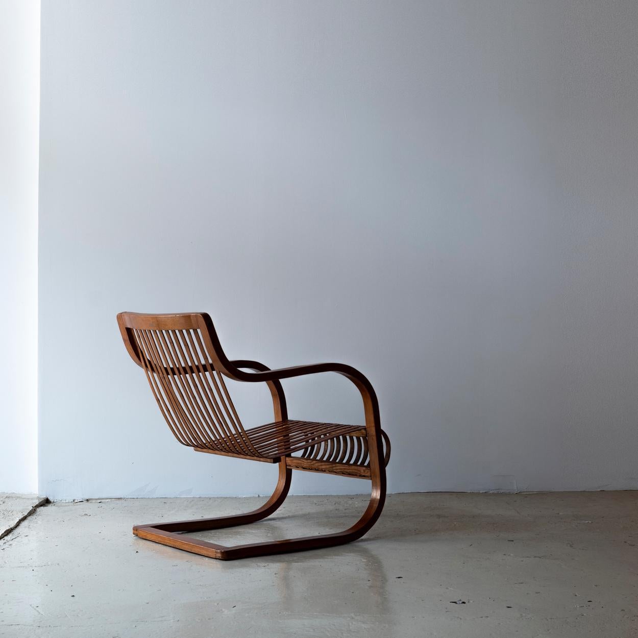 Bamboo chair designed by Ubunji Kidokoro in 1937 for the Mitsukoshi furniture design room. It was designed inspired by the design of Alvar Aalto's Model 31 armchair. The cantilever structure is made of naturally dried and de-oiled bamboo and