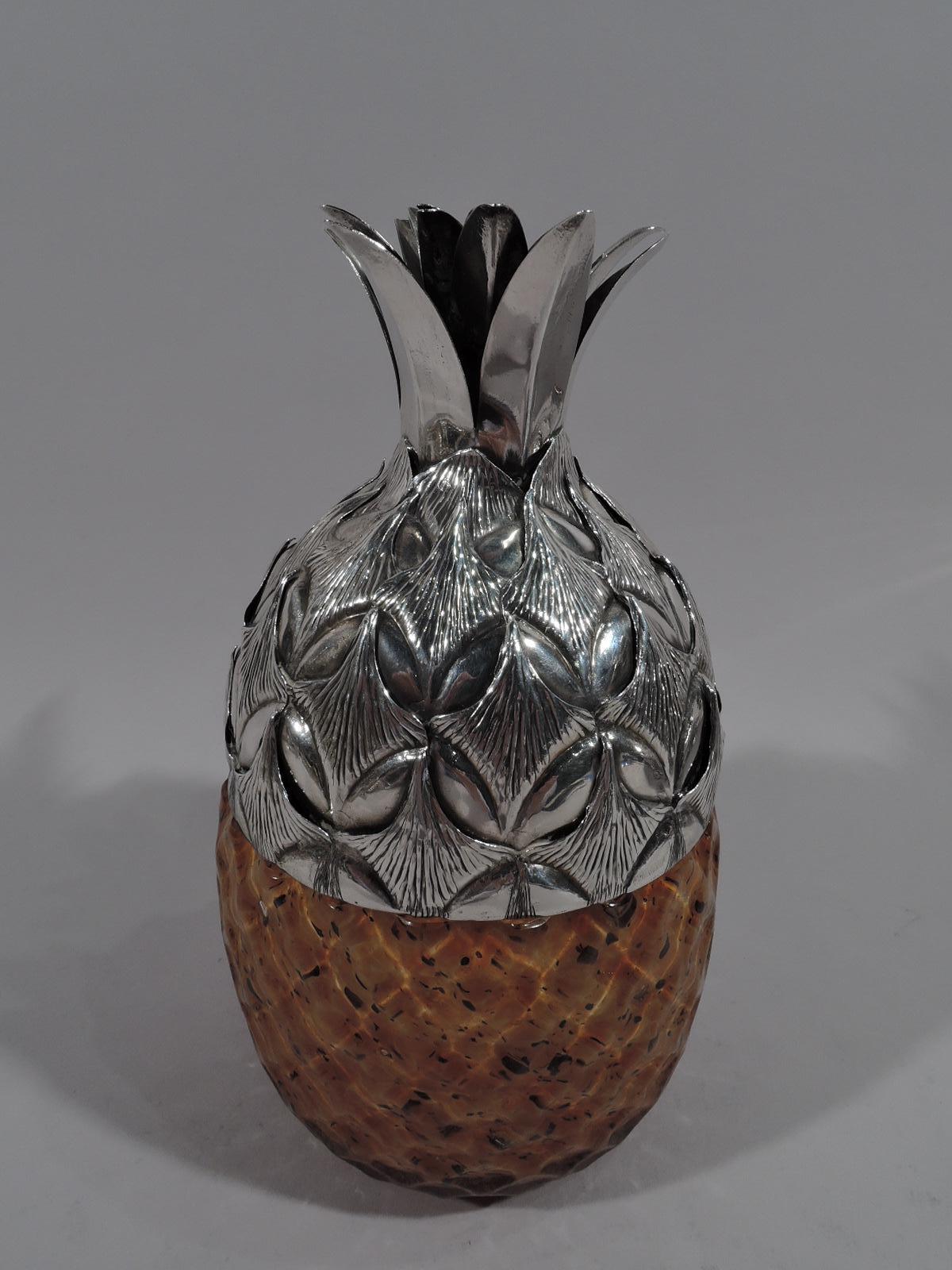 Figural pineapple jar in sterling silver and Murano glass. Made by Buccellati in Italy. Translucent and speckled golden-brown glass with softly textural diaper pattern. Interior solid white. Sterling silver domed cover with textural skin pattern and