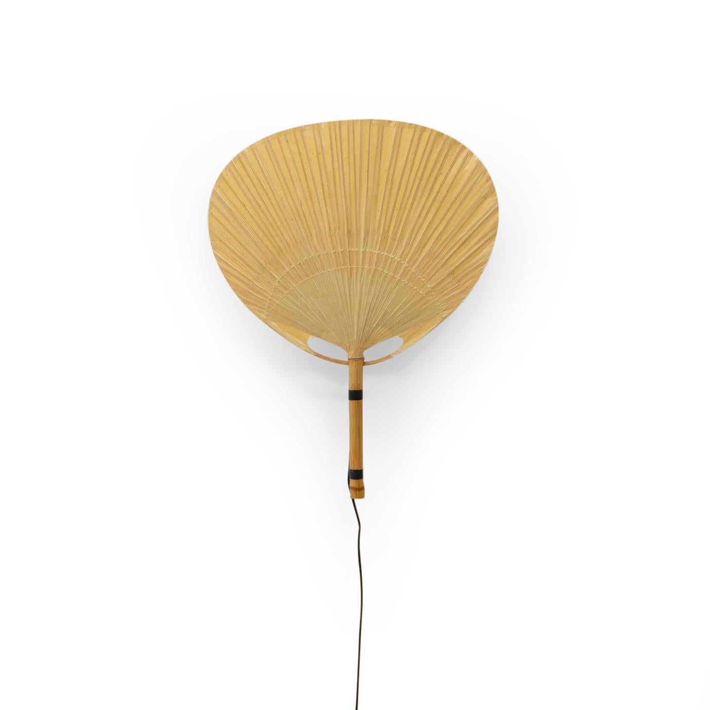 An Uchiwa wall lamp by Ingo Maurer produced by his company Design M during the late 1970s in Germany.


Uchiwa lamps are made from rice paper supported by a bamboo stem; their frail structure gives them a beautiful simplistic and pure appearance.
