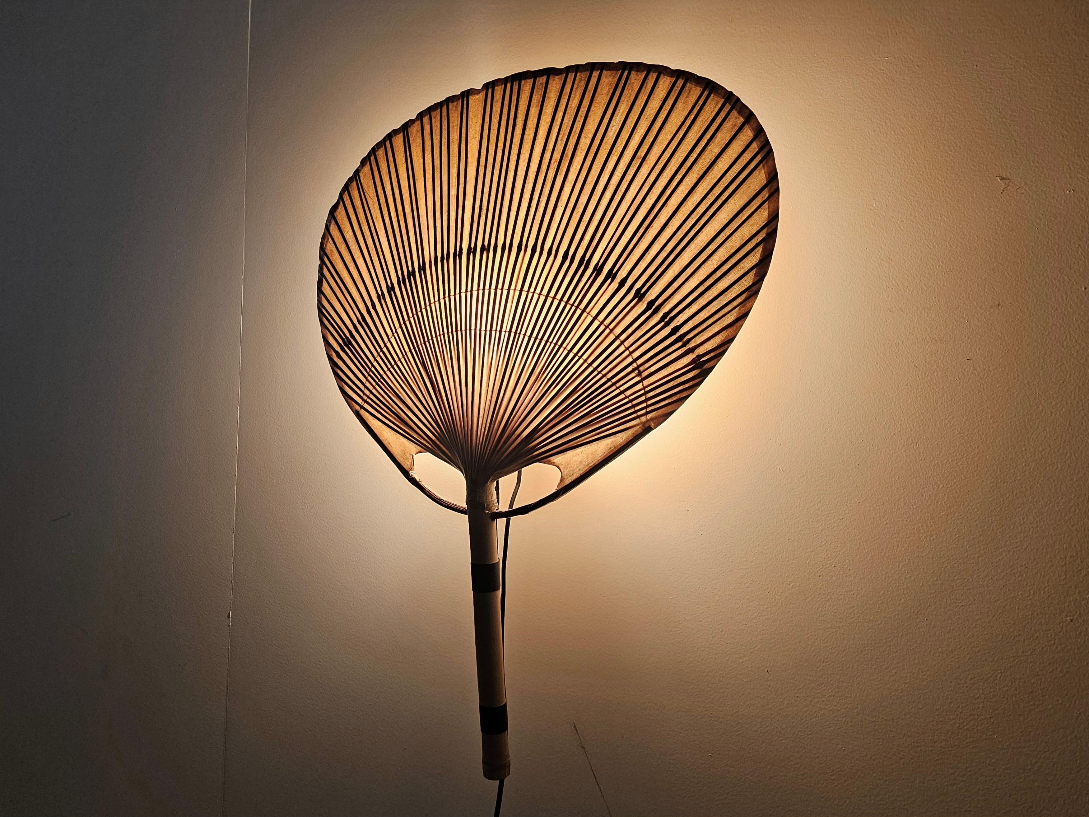Stunning early edition Uchiwa III wall light by Ingo Maurer for Design M, 1970s, Germany. 

All the Uchiwa lamps were handcrafted from Japanese bamboo and rice paper. It gives a beautifully warm and diffuse glow. 

Quite difficult to find examples