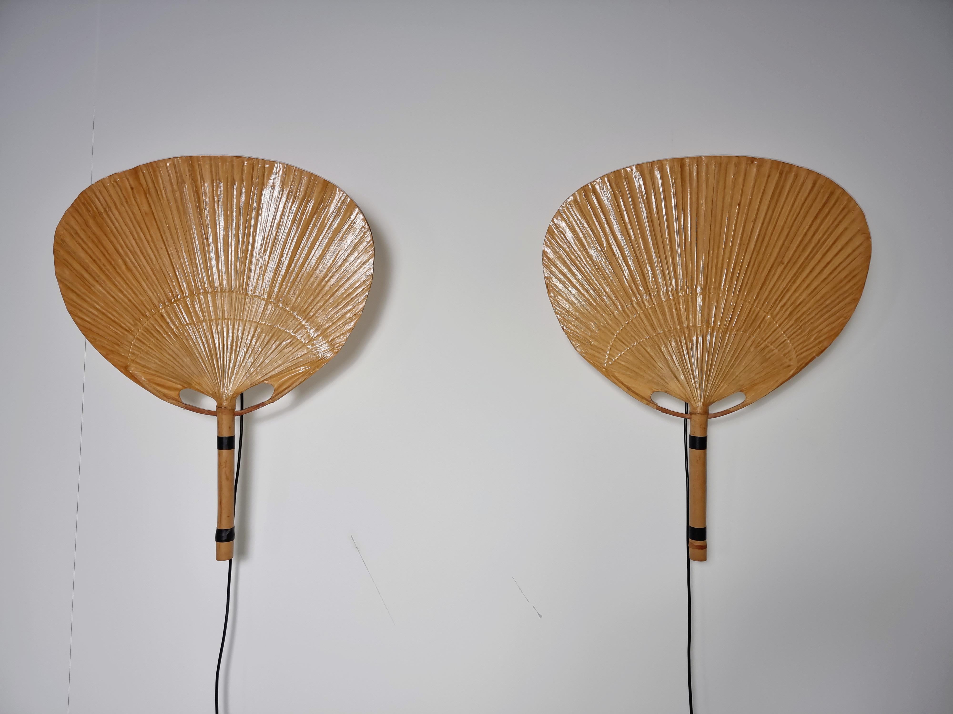A pair of Uchiwa III wall lights by Ingo Maurer for Design M, 1970s, Germany. All the Uchiwa lamps were handcrafted from Japanese bamboo and rice paper. It gives a beautifully warm and diffuse glow. Quite difficult to find examples in very good