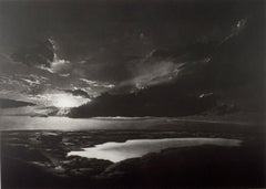 Vintage Icelandic Landscape (The sun creates dramatic cloud pattern over a glacial lake)