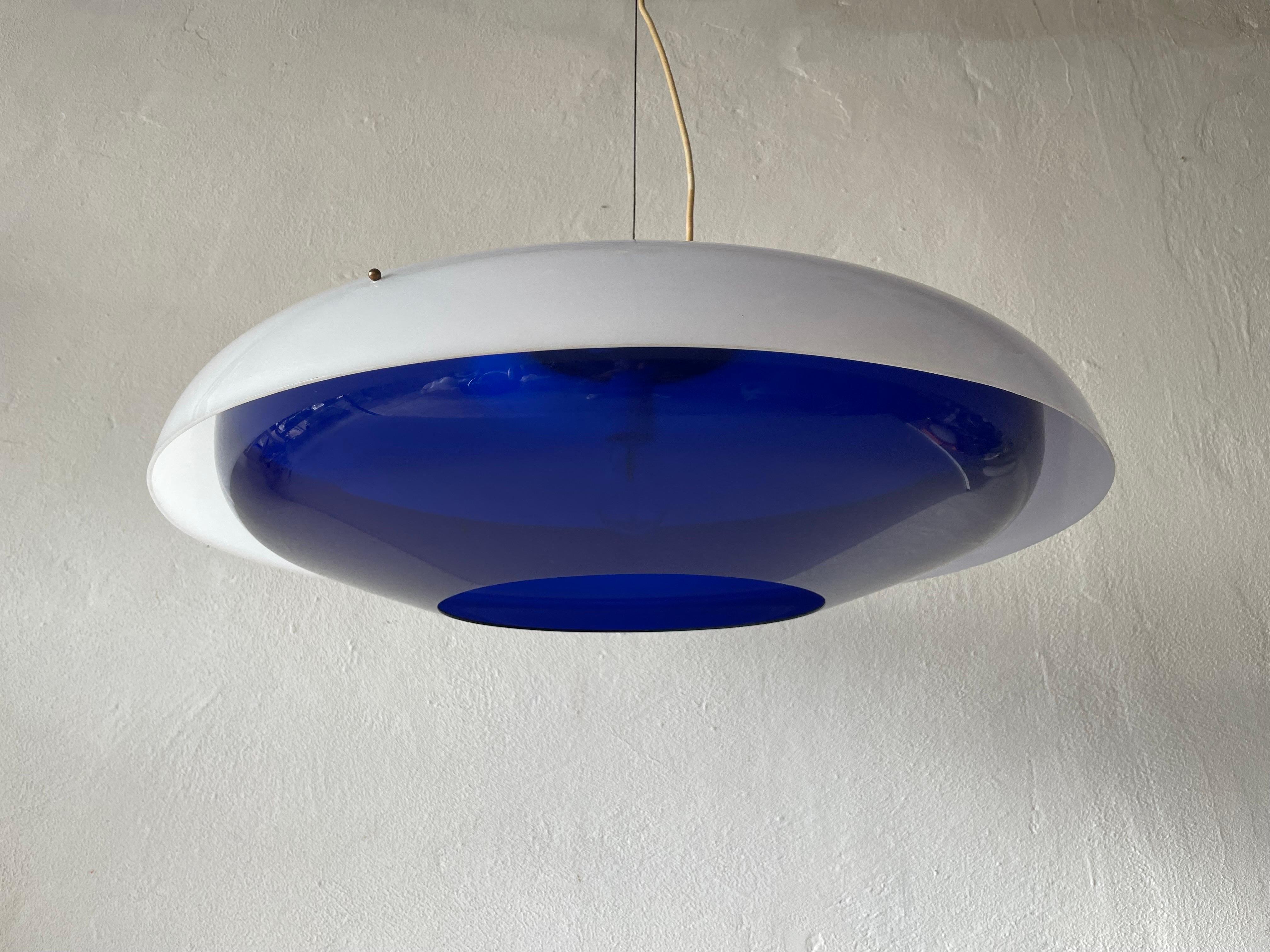 Ufo Design Blue & White Plexiglass XXL Pendant Lamp, 1970s, Italy

Lampshade is in very good vintage condition.

This lamp works with E27 light bulb. 
Wired and suitable to use with 220V and 110V for all countries.

Measurements:
Diameter: 65