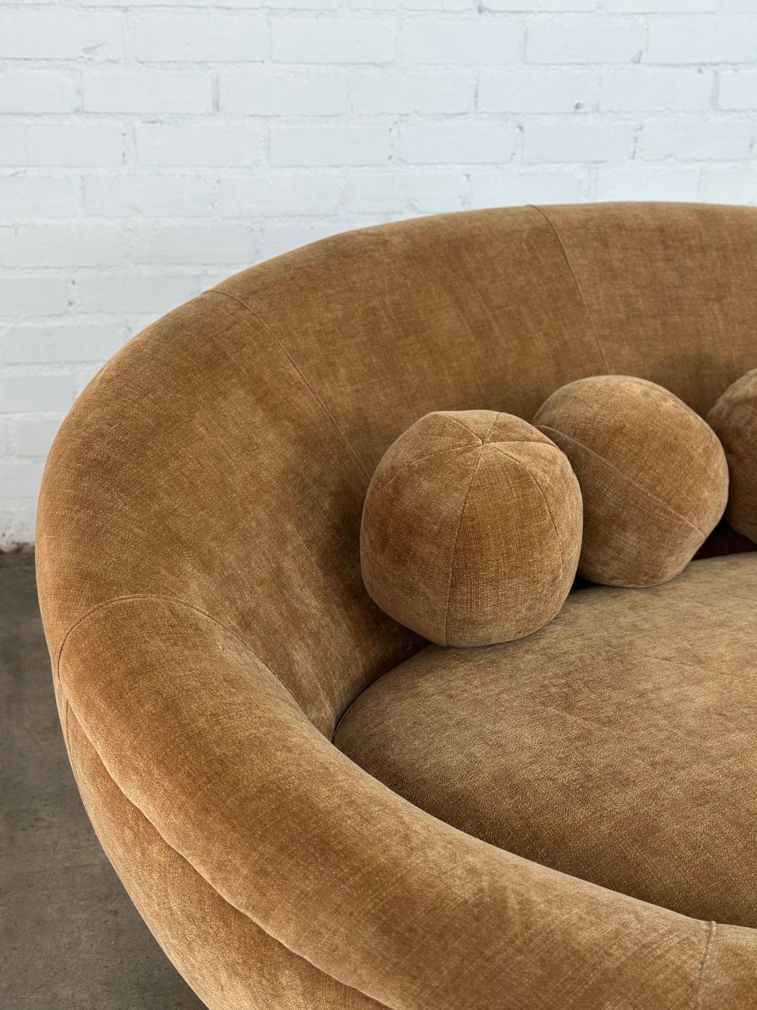 W80 D68 H33.5 SW59 SD45 SH17

Vintage UFO Sofa by Cellini, this is the larger version they made. Item is newly upholstered in a cognac chenille. Sofa features four custom made orb pillows.