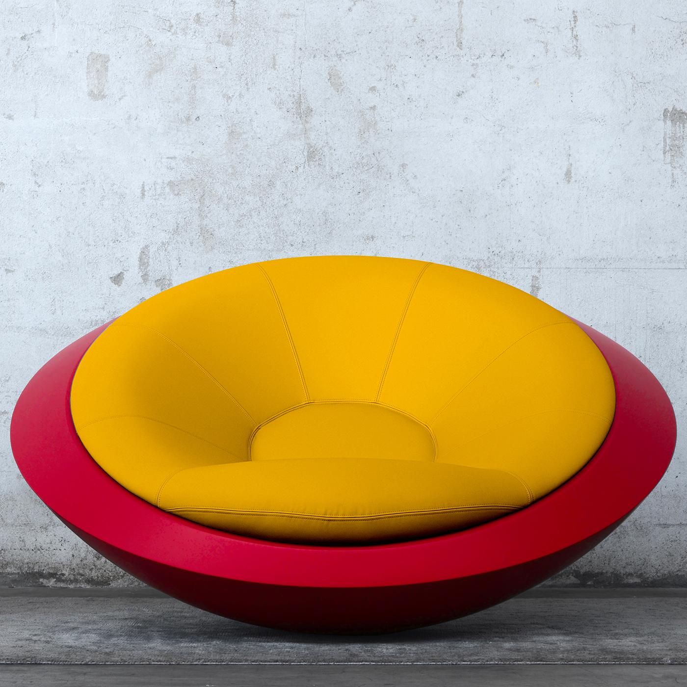 Reminiscent of a space capsule, this vivacious armchair is uniquely designed and made to order. Boasting a refined and contemporary allure, the soft cushion is filled with foam rubber and is hand upholstered with yellow, sustainable full grain