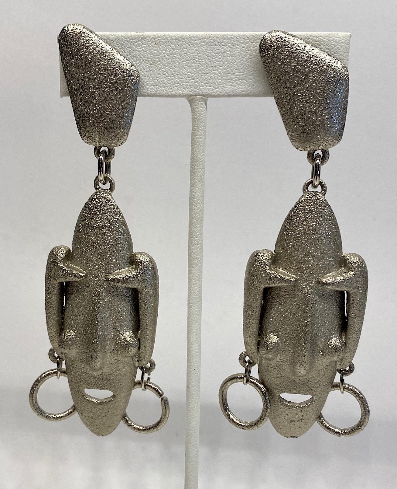 Italianjewelry and  fashion jewelry designer Ugo Correani 1980s large face pendant earrings in the style of Modigliani. Each of the elongated faces are reminiscent of the portraits of the artist Modigliani. They are cast and finished in a textured