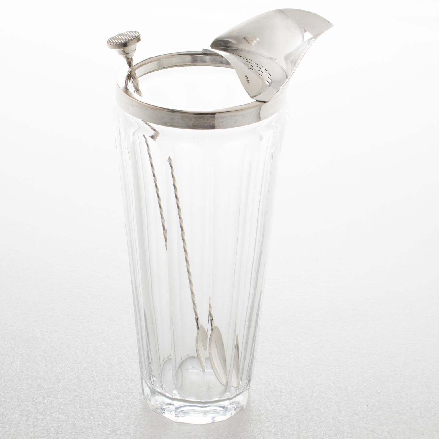 Italian silversmith Ugo Sandrucci crafted this elegant Art Deco barware set in the 1940s. This set of cocktail essentials boasts a sleek modernist design and a functional shape. The tall Martini pitcher or mixer jug is made of cut crystal and