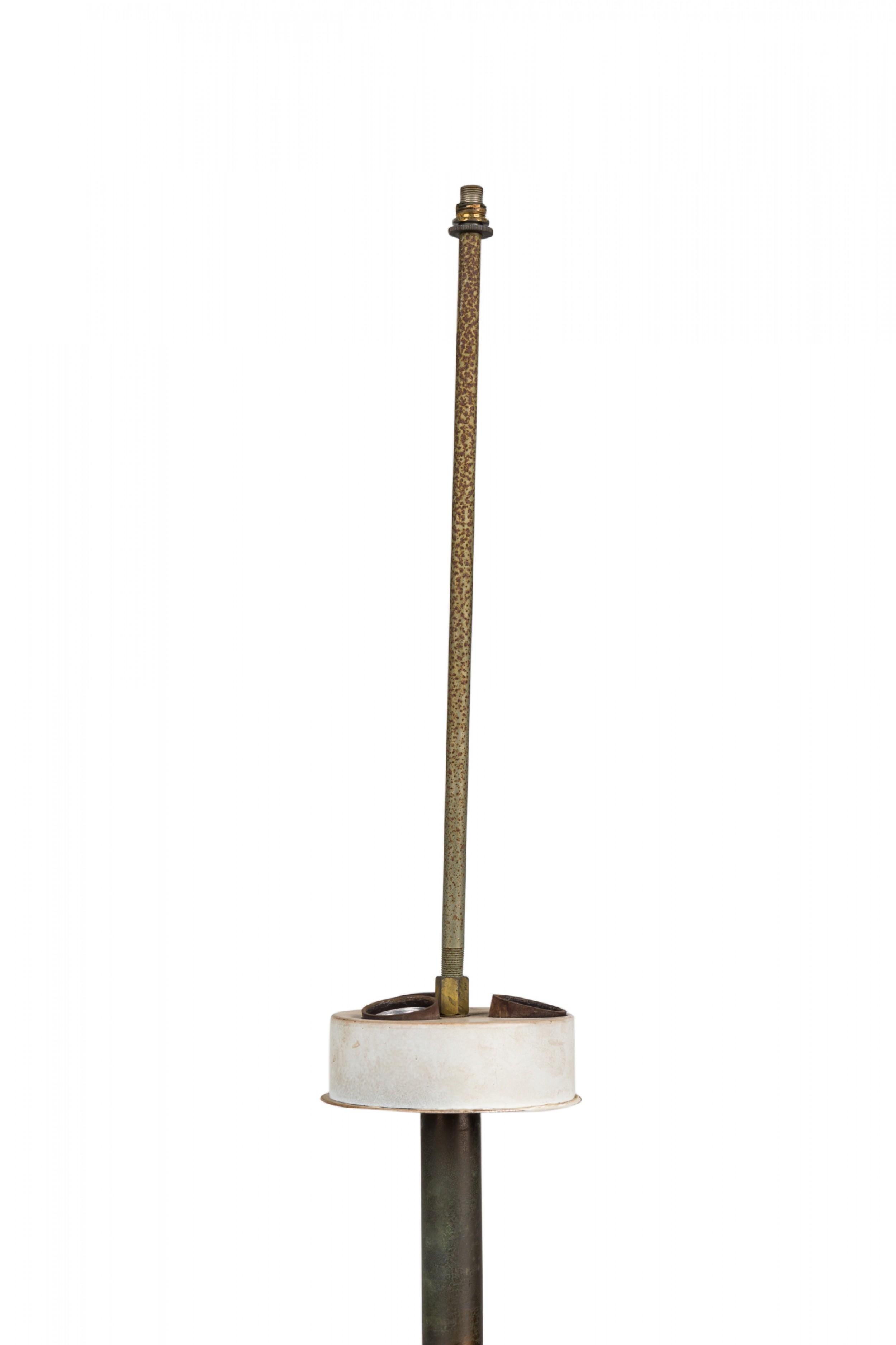 Mid-Century Italian ceramic urn repurposed as a table lamp in footed ovoid form with cylindrical neck topped by a ceramic banded sphere finial and a circular 3-way nonfunctioning white light switch socket, the body glazed in glossy white, decorated