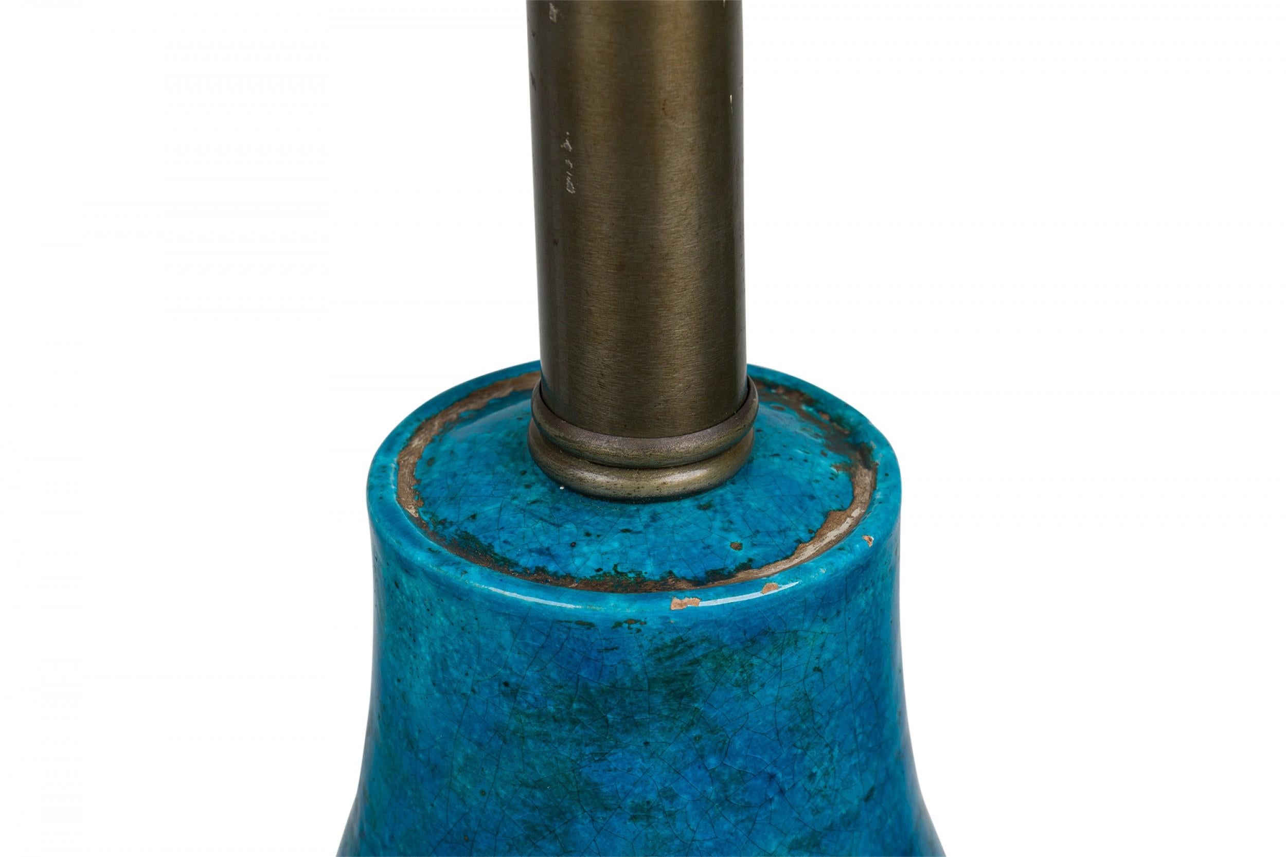 Mid-Century Italian ceramic table lamp in ovoid form with a tapered neck leading to a brushed pewter metal stem and functioning cupped light switch socket, the body incised with three decorative rows of banding and fired in a vivid turquoise /  blue