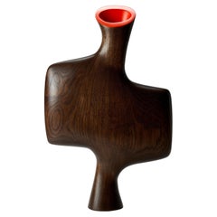 Uhuru 0.4, an oak wooden abstract sculpture with red interior by Donald Baugh