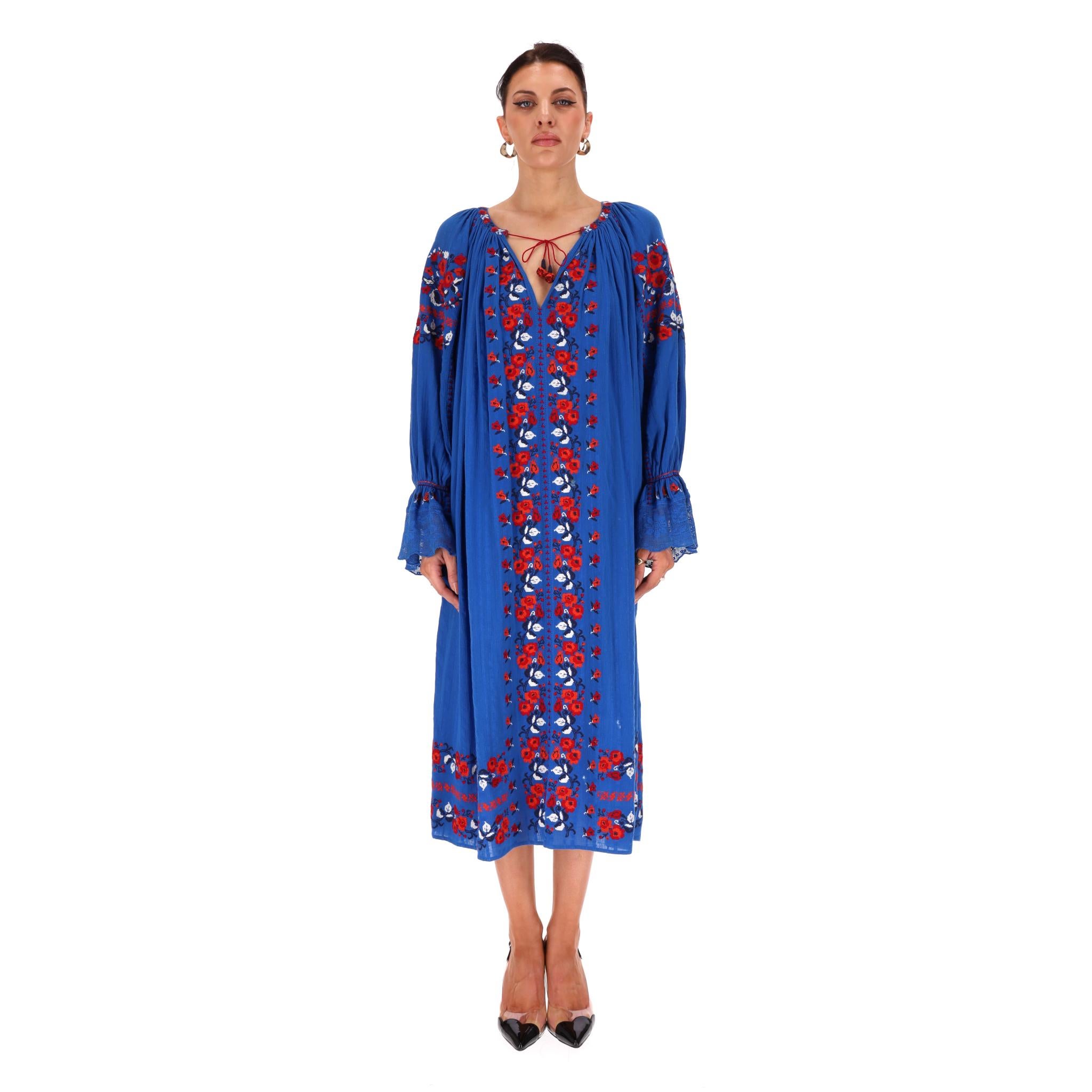 Ulla Johnson Boho Midi Cotton Dress

Cobalt blue cotton dress designed in the brand's signature bohemian aesthetic with stripe pattern adorned with colourful floral embroidery.

Featuring V-neck with tie-up detail, elasticated cuffs and relaxed