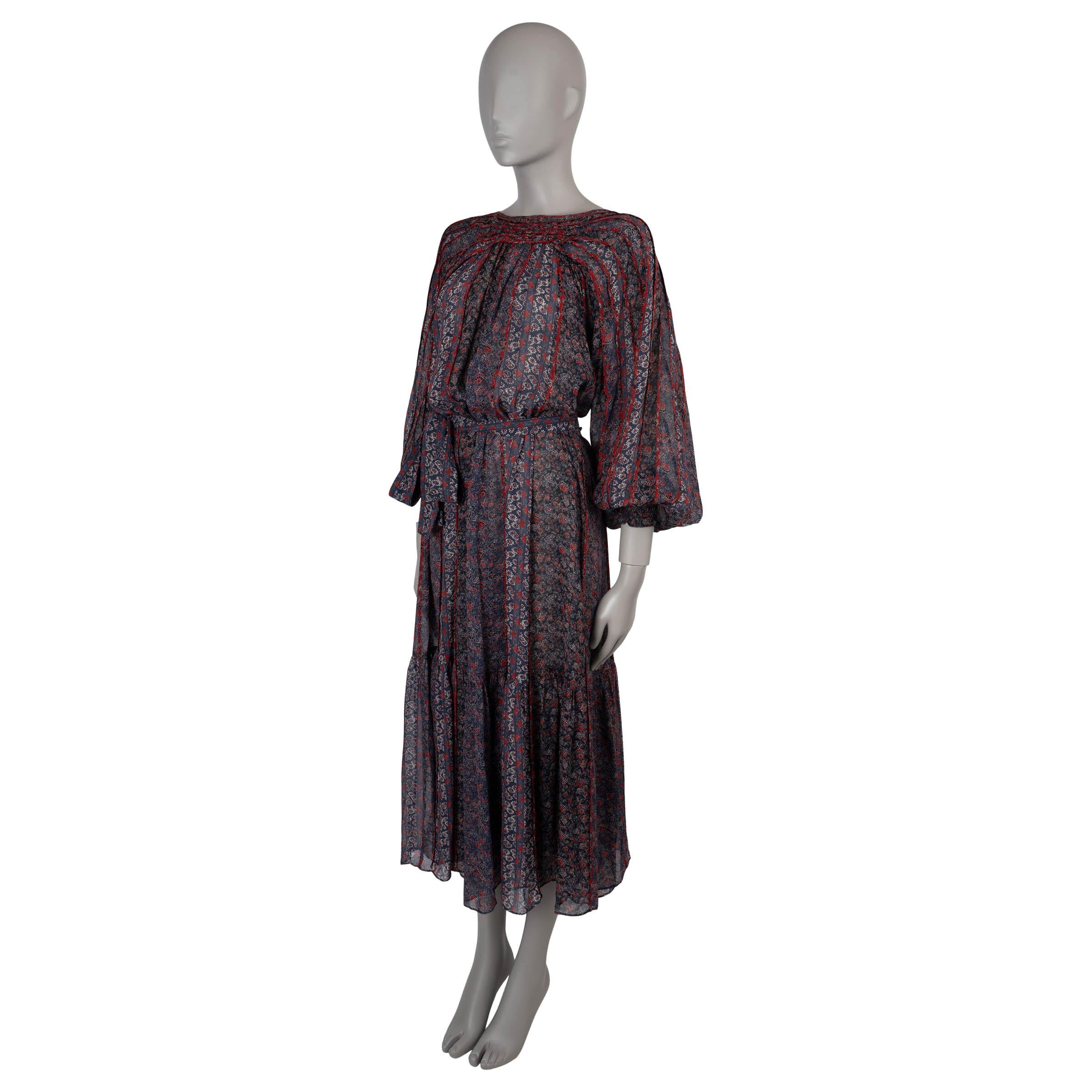 This stunning 100% authentic Ulla Johnson Xenia midi dress is crafted from 100% semi-sheer silk in a rich Twilight blue with a vibrant floral print in red and white. The elegant boatneck design is complemented by delicate pleat detailing and long