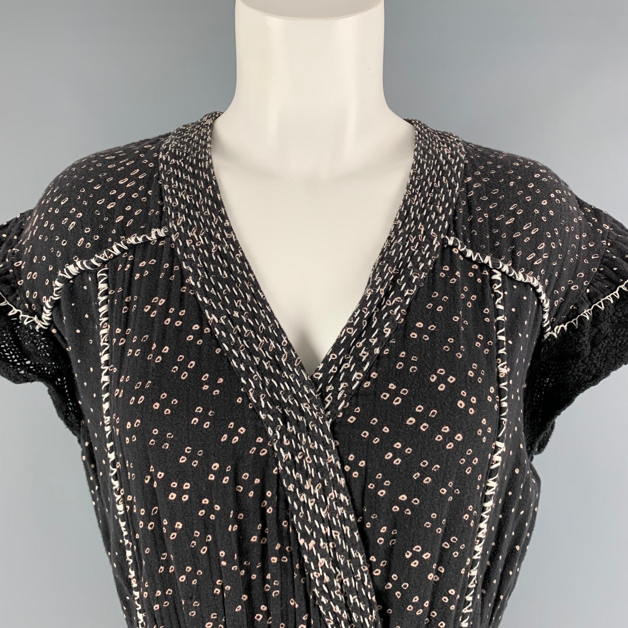 ULLA JOHNSON jumpsuit comes in cream and black cotton woven material featuring a
 V neckline,black crochet details at sleeves, elastic waist, pockets , and elastic hem at legs. Good Pre-Owned Condition. Moderate signs of wear, and color fading.
