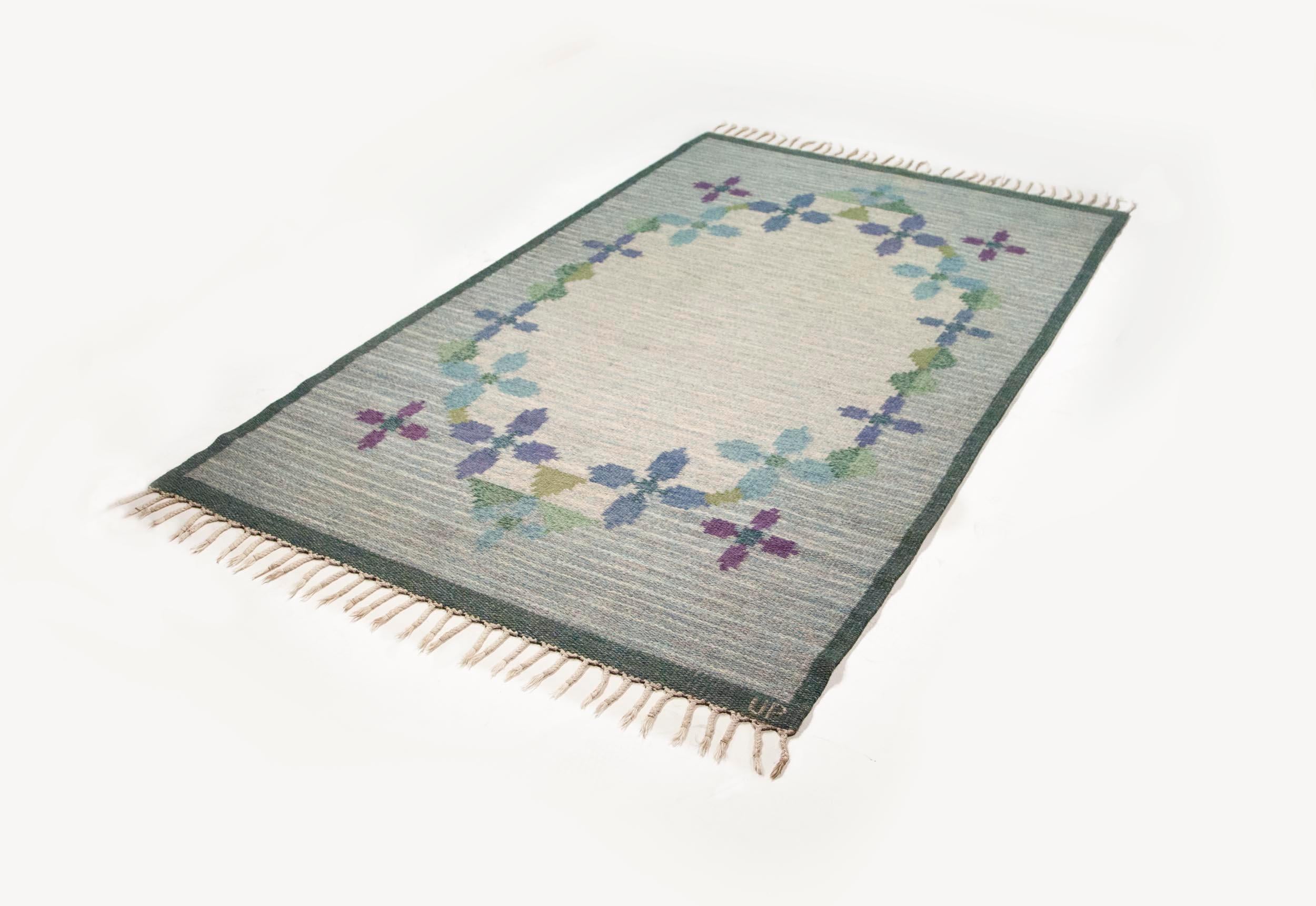 Ulla Parkdah Swedish flat-weave rug, signed UP, Sweden, 1960s

This particular Swedish carpet is a wonderful representation of midcentury Scandinavian rug design, especially in its treatment of geometric floral details. In the case of this carpet,